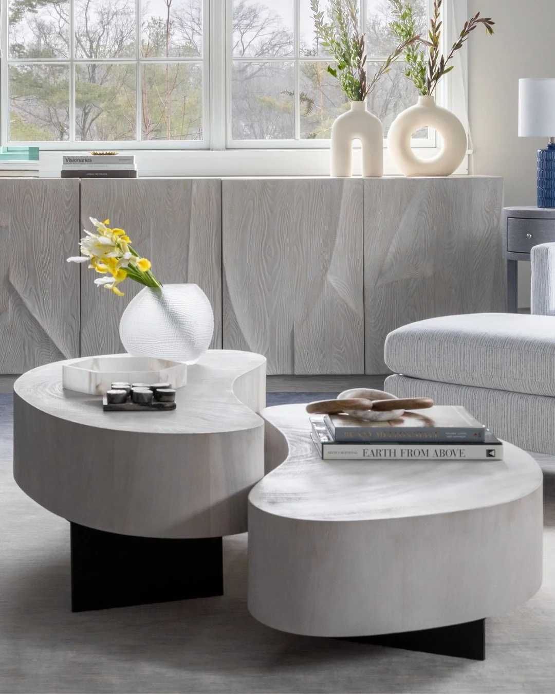 Organic shapes are a deliberate way to soften a room. In spaces defined by strong geometry, I introduce curves to create balance and a sense of movement. 

In this formal living room, that approach led to this coffee table, where function and form co