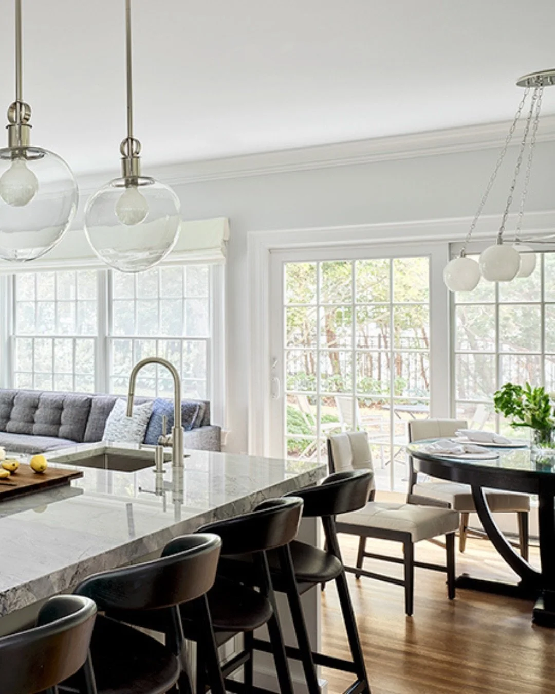 🚨Before &amp; After

Same view, completely transformed space. 

Featuring quartzite countertops, a beautiful natural stone known for its organic movement and durability, statement lighting, modern counter stools, rich hardwood flooring, and architec