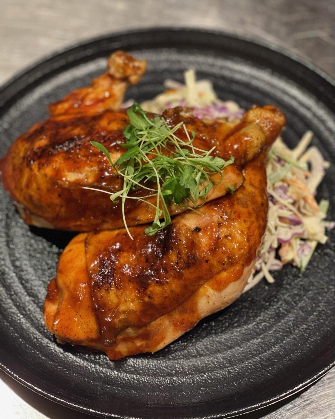Where there&rsquo;s smoke, there&rsquo;s an open wood fire. 

The Smokehouse Chicken: Spicy Honey Ancho BBQ and a side of slaw - the best of the backyard fare.