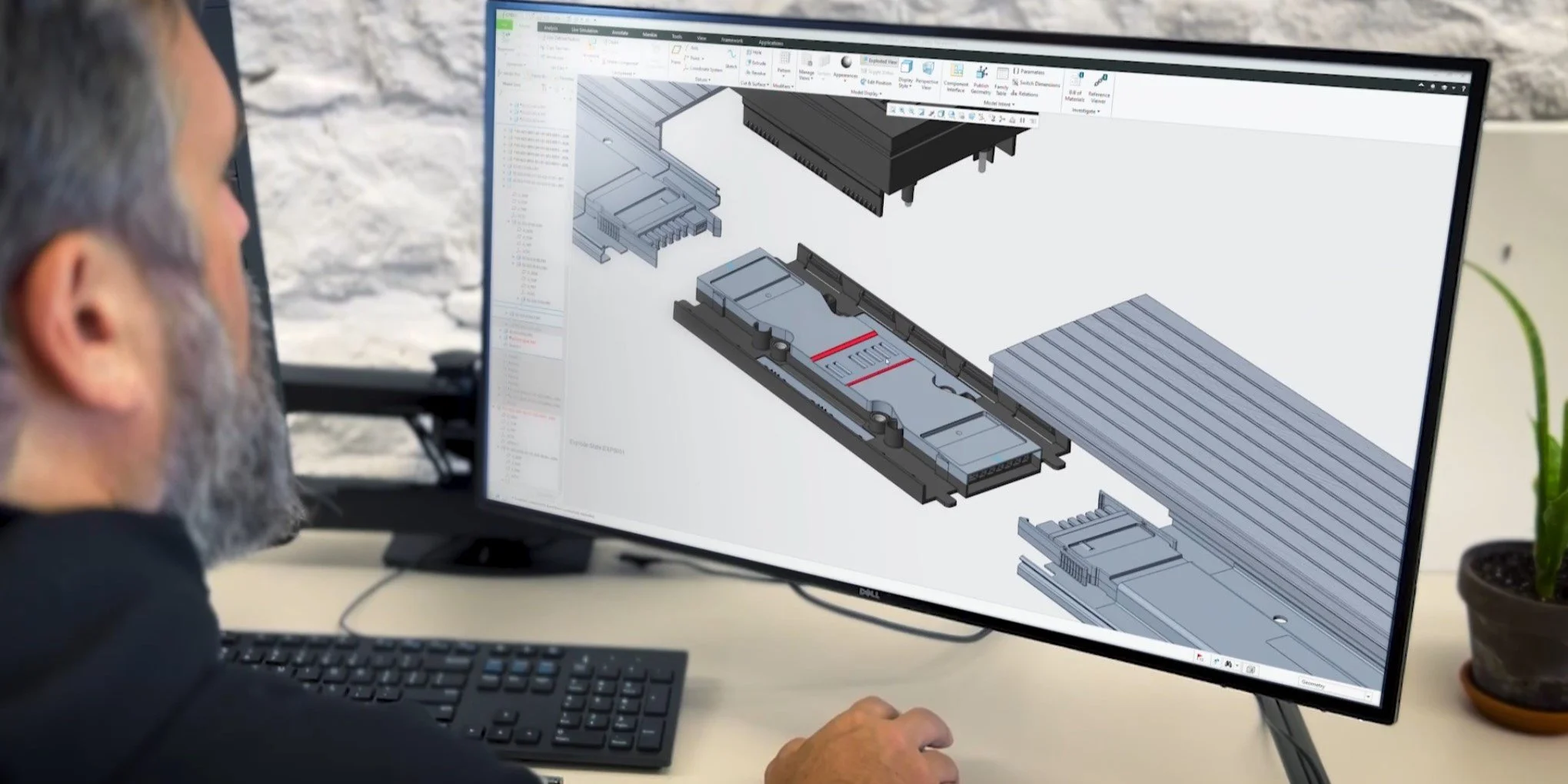 Man modeling an object in a computer