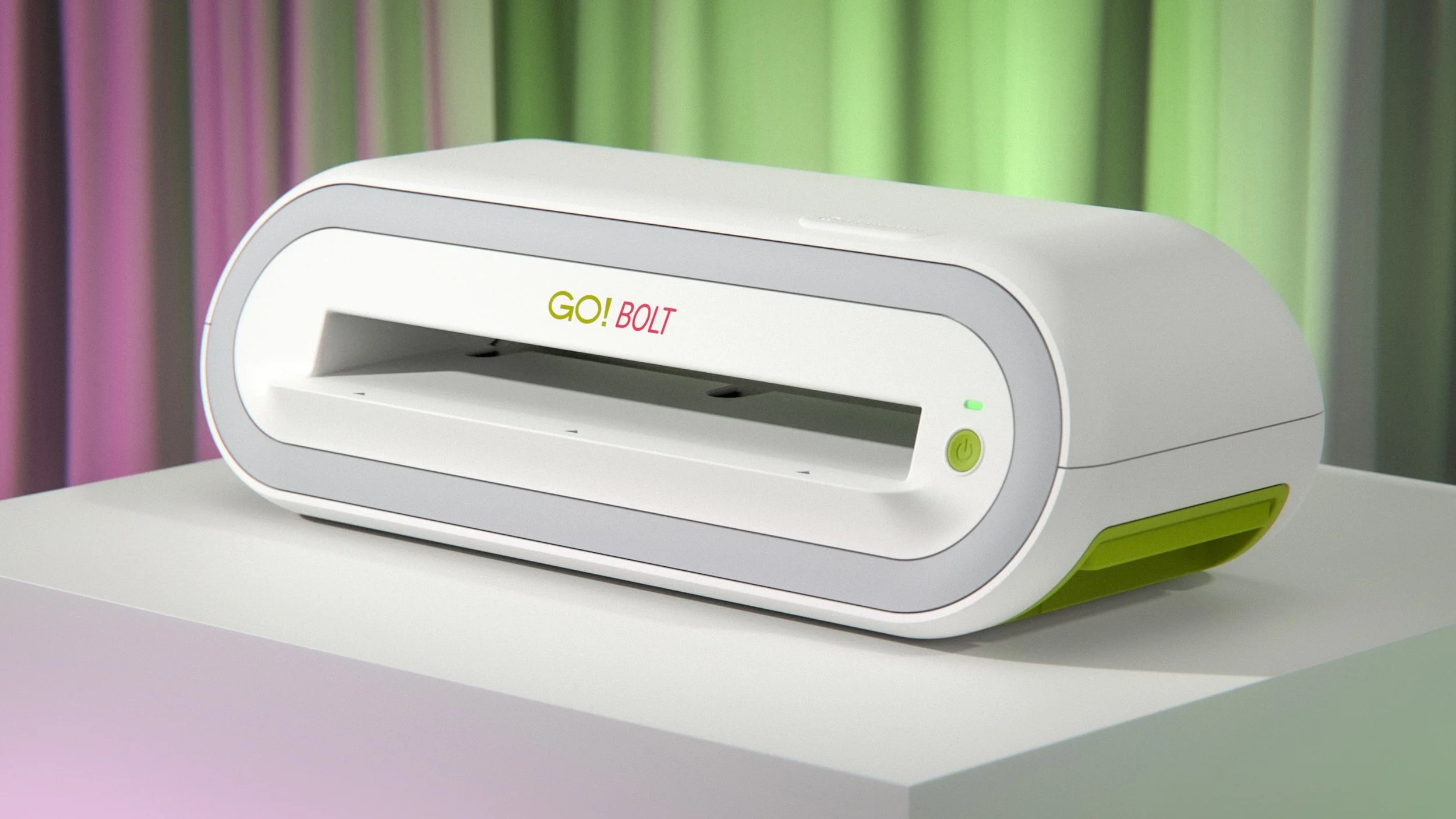 AccuQuilt Go Bolt fabric die cutter on a pedestal