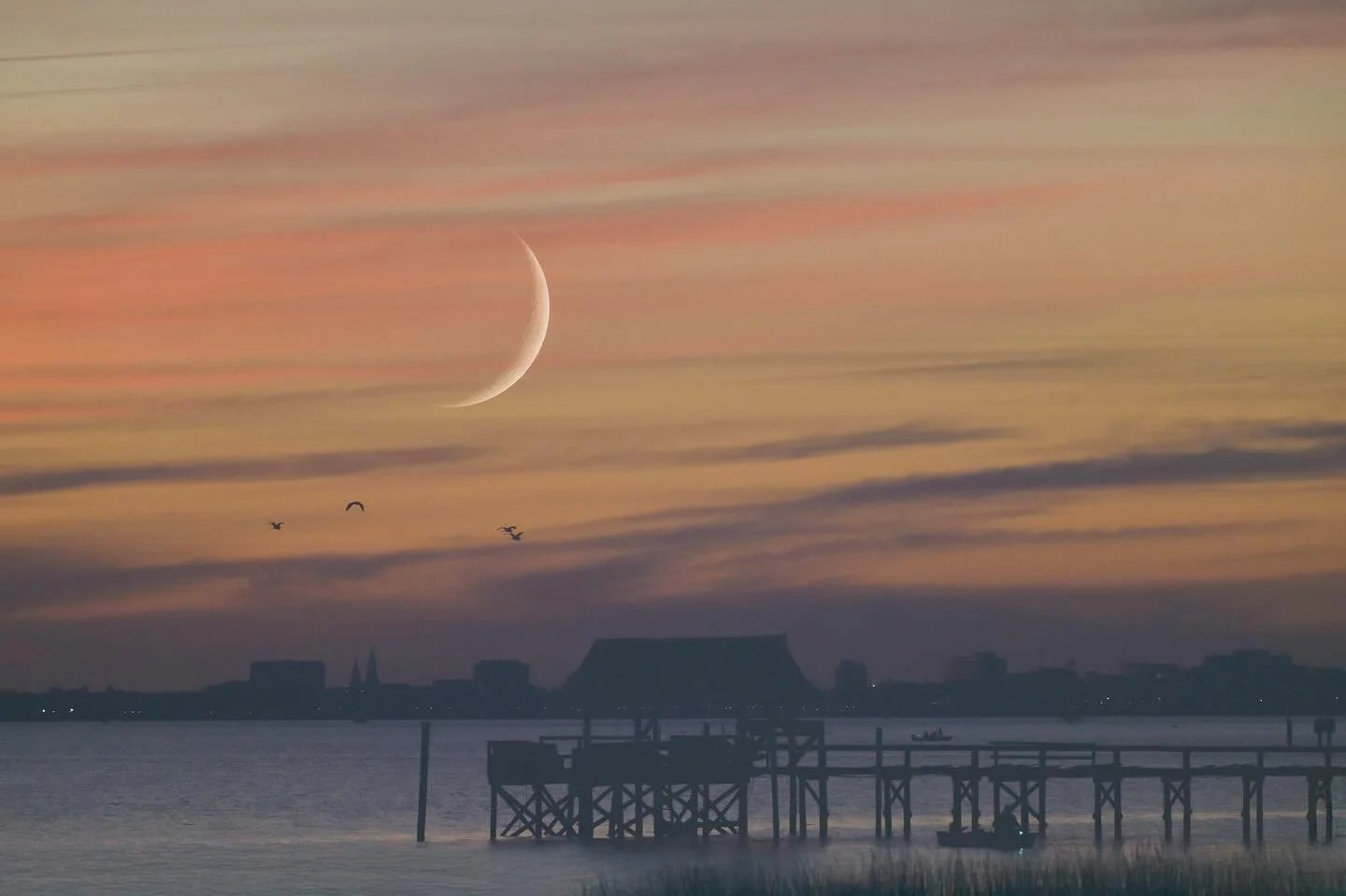 It was a clear night with a beautiful, colorful sunset fading into deep blue. With a little vision and some experimenting, I tried something different.
The moon was large and bright but just out of frame of the landscape I wanted to capture. So I use