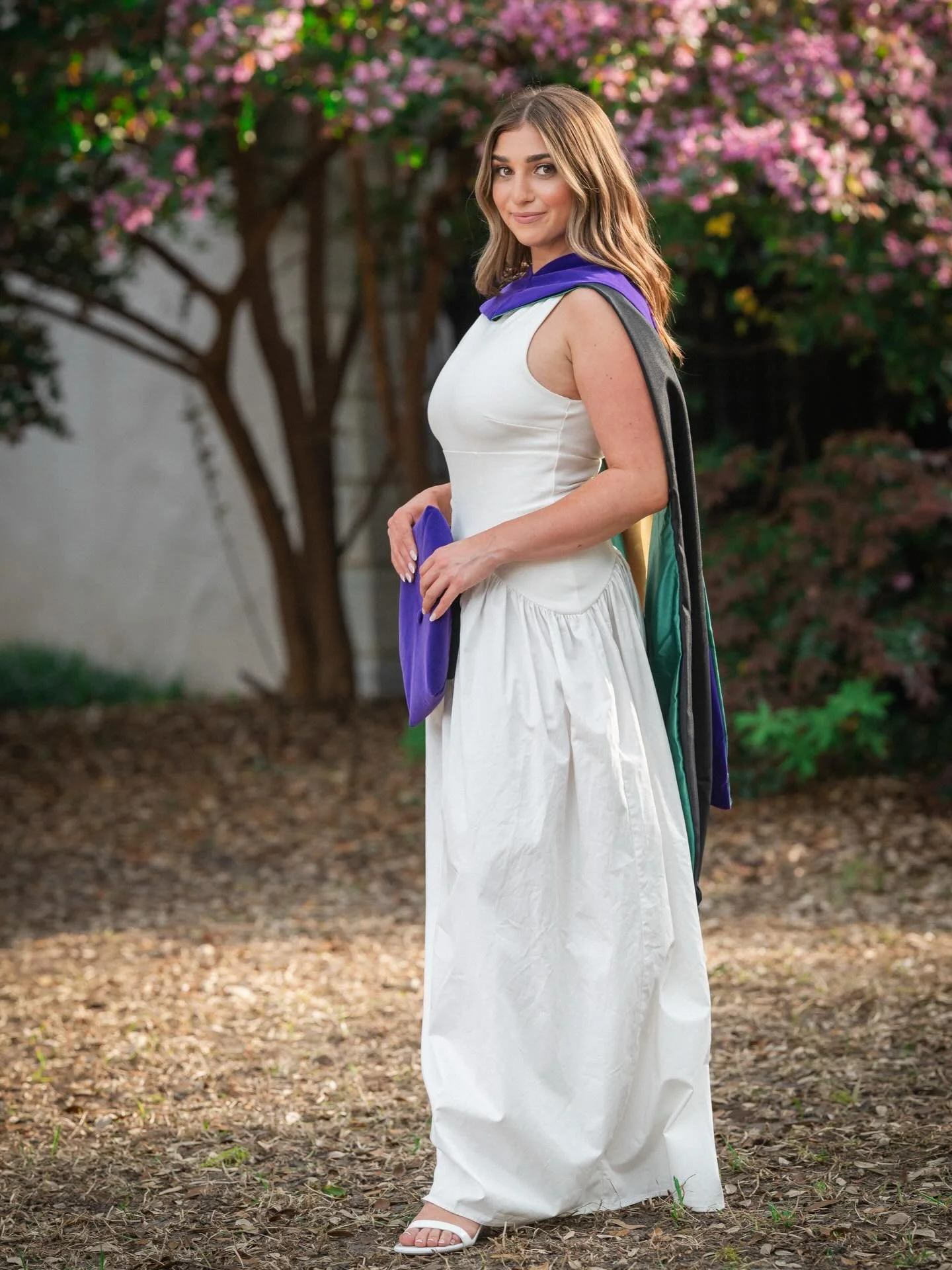 She knew exactly what she wanted for her graduation photo session.
We started in the French Quarter, made our way down to The Battery, and finished at the United States Custom House. 

Warm evening light, blooming vines, layers of color and texture t