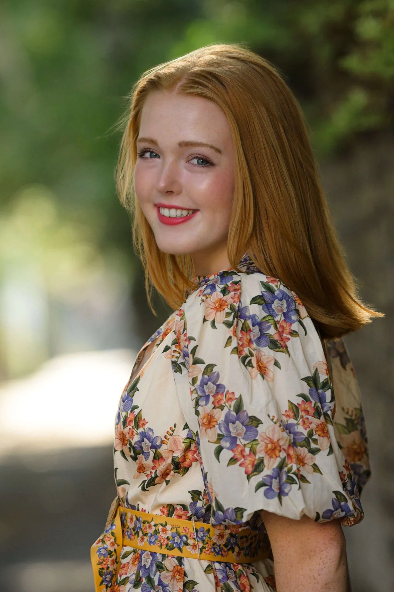 senior-portrait-back-lighting-smiling-over-the-shoulder.jpg