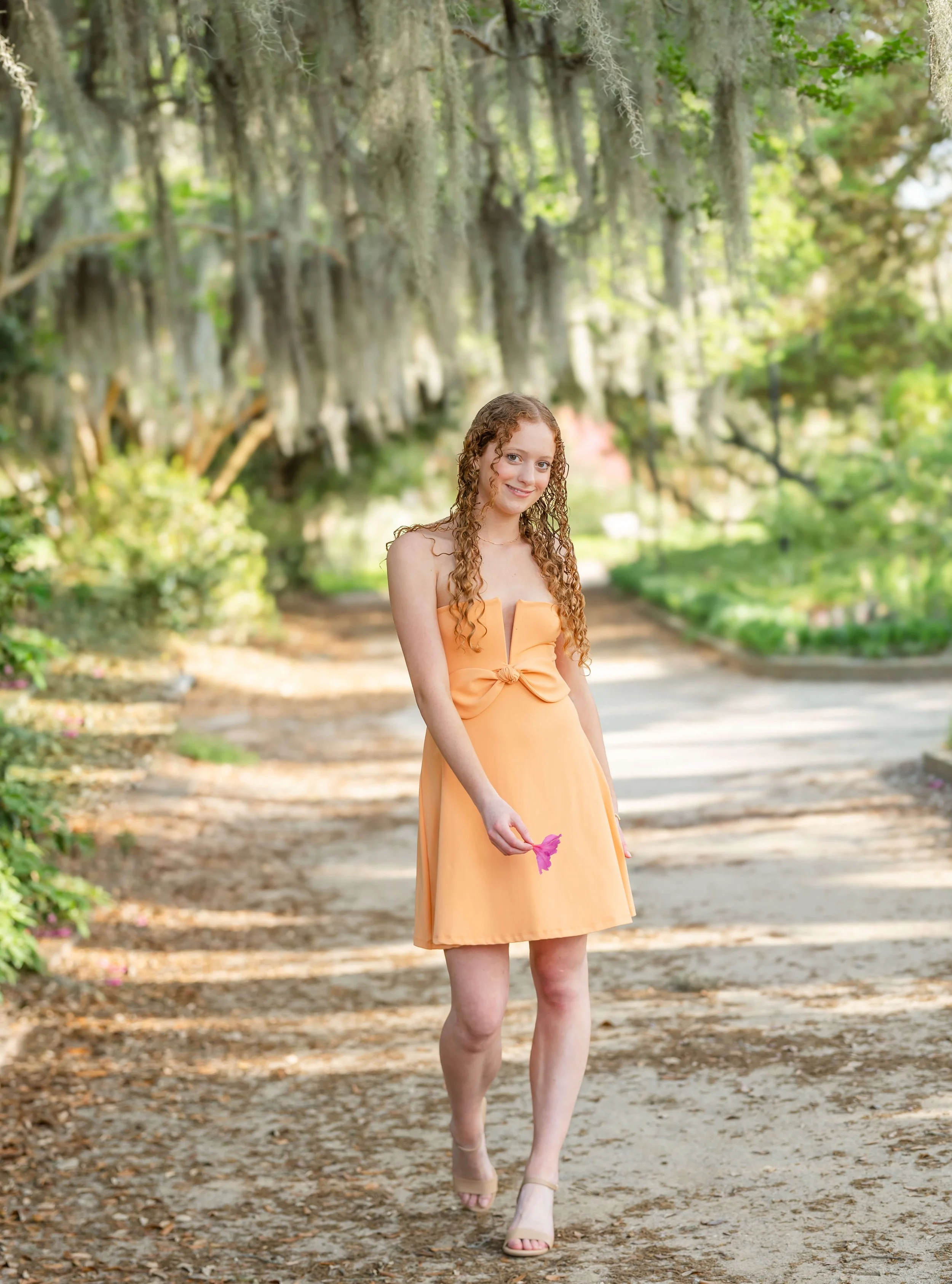 Senior portrait in late afternoon light at Hampton Park Charleston