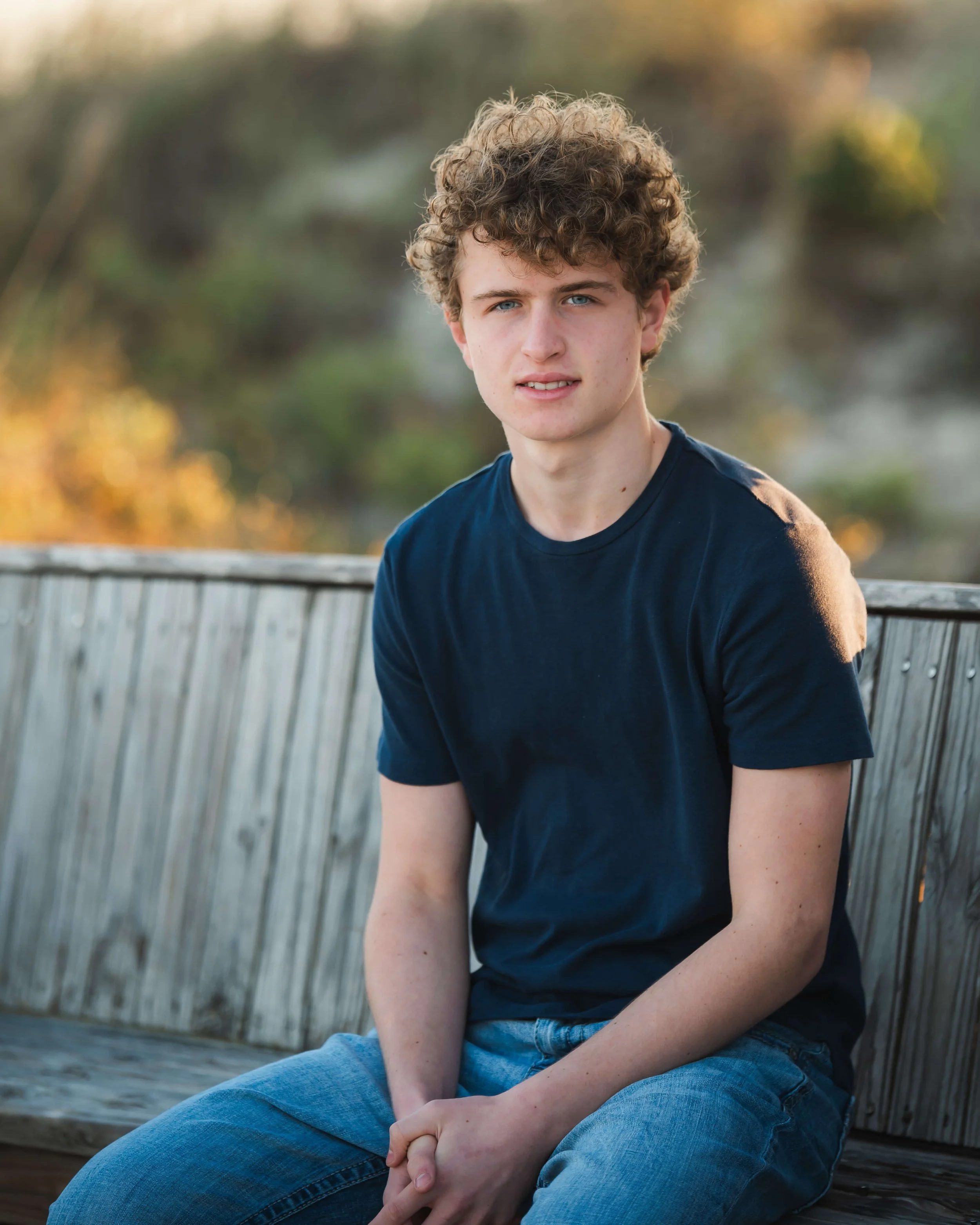 senior-portraits-boy-beach-isle-of-palms-sitting.jpg
