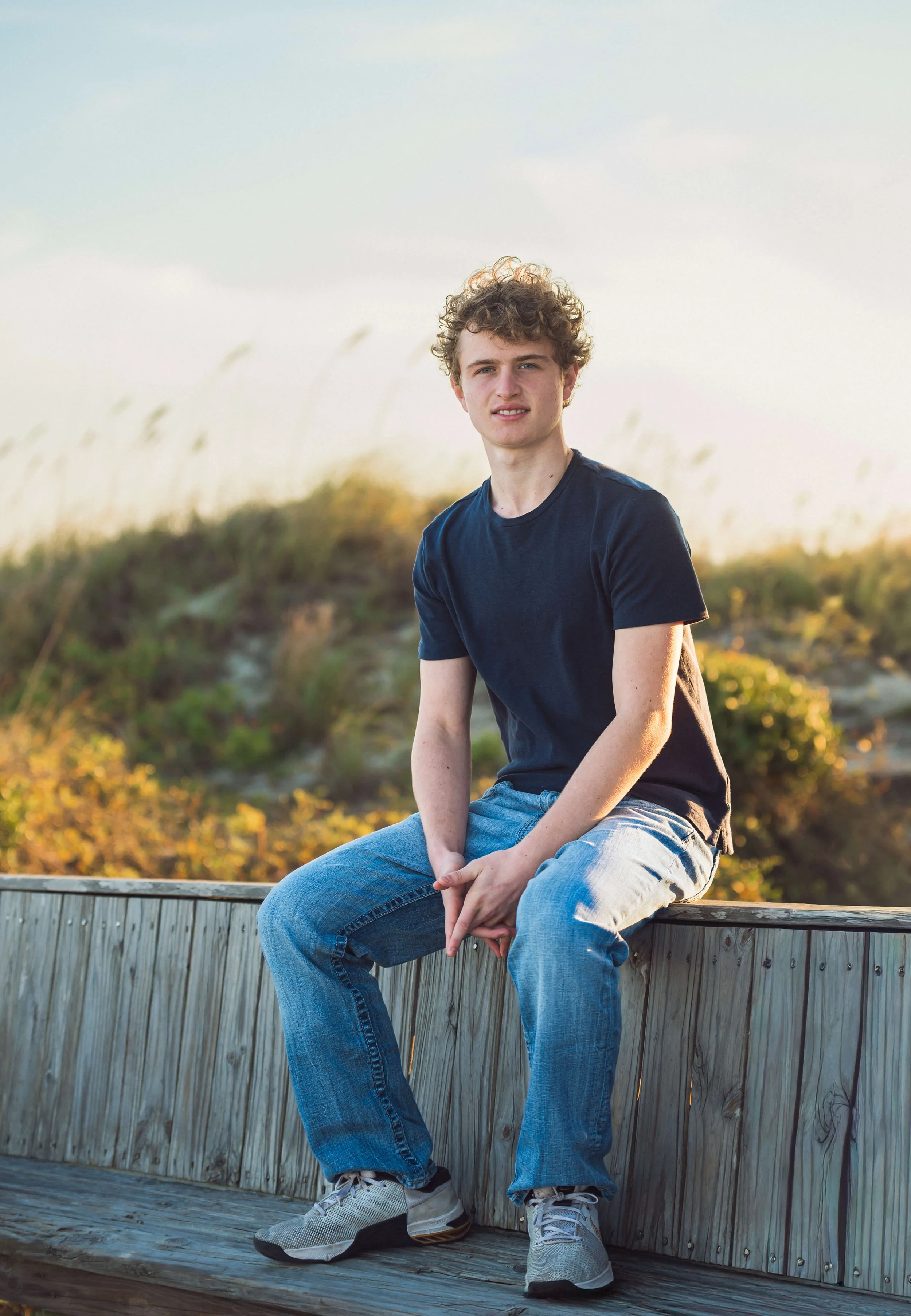 senior-session-isle-of-palms-boy-blue-shirt-sunset.jpg