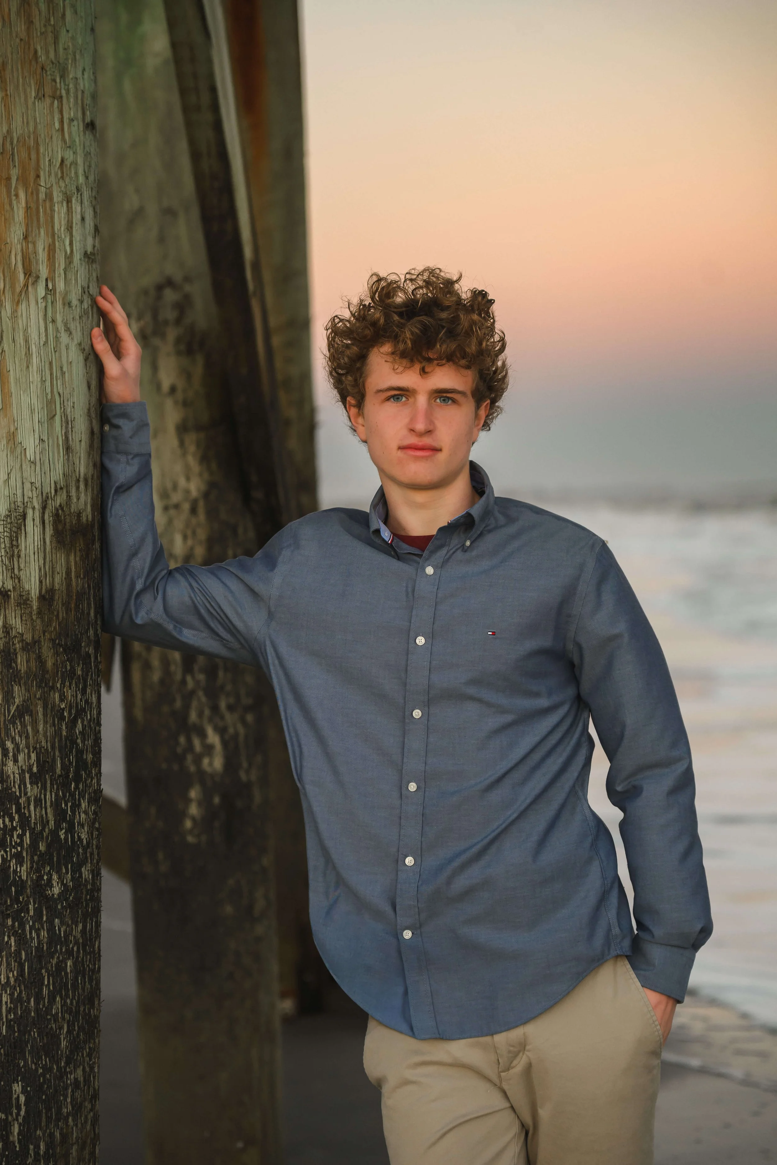 senior-portraits-boy-pier-beach-isle-of-palms.jpg