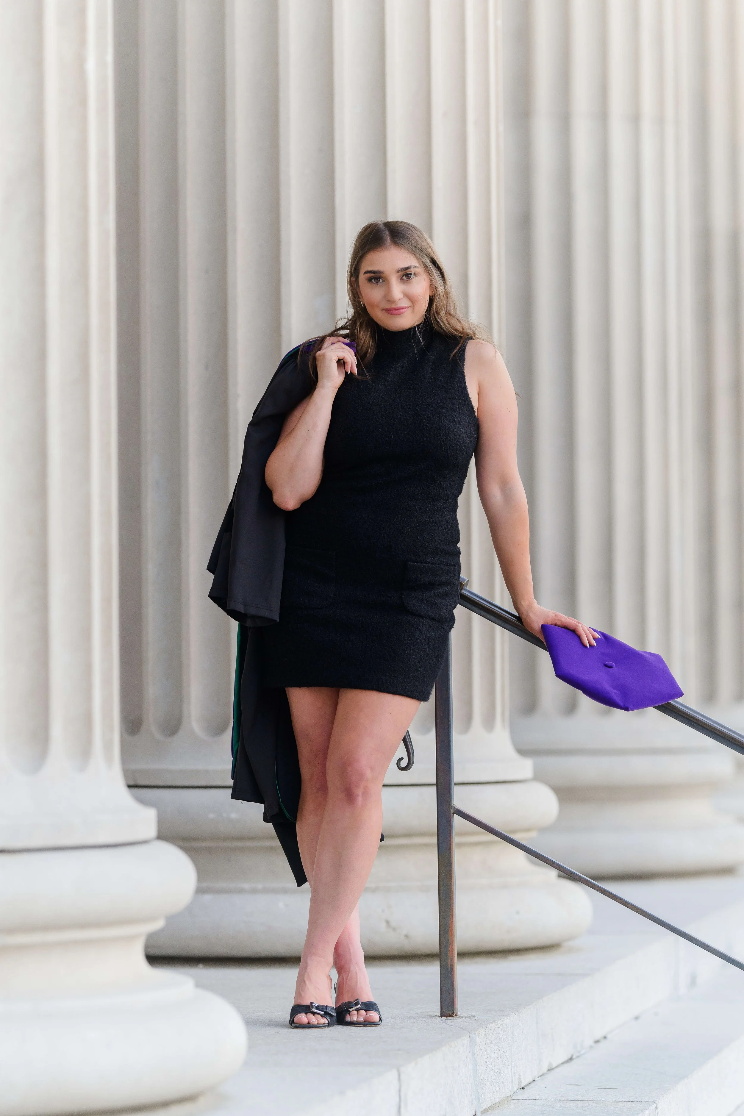 Charleston School of Law Grad Student leaning  on railing  at US Customs House