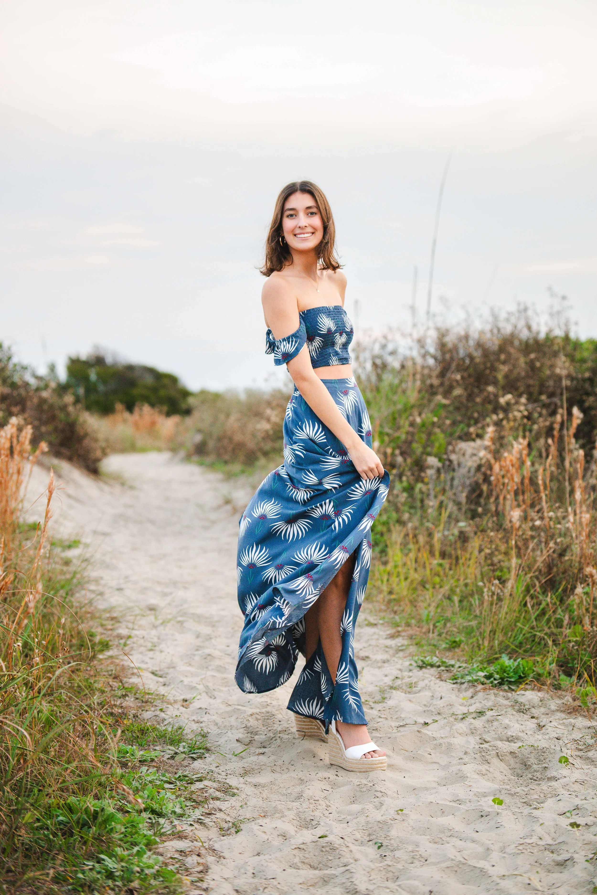 Girl at pretty path at IOP in SC posing for senior photos