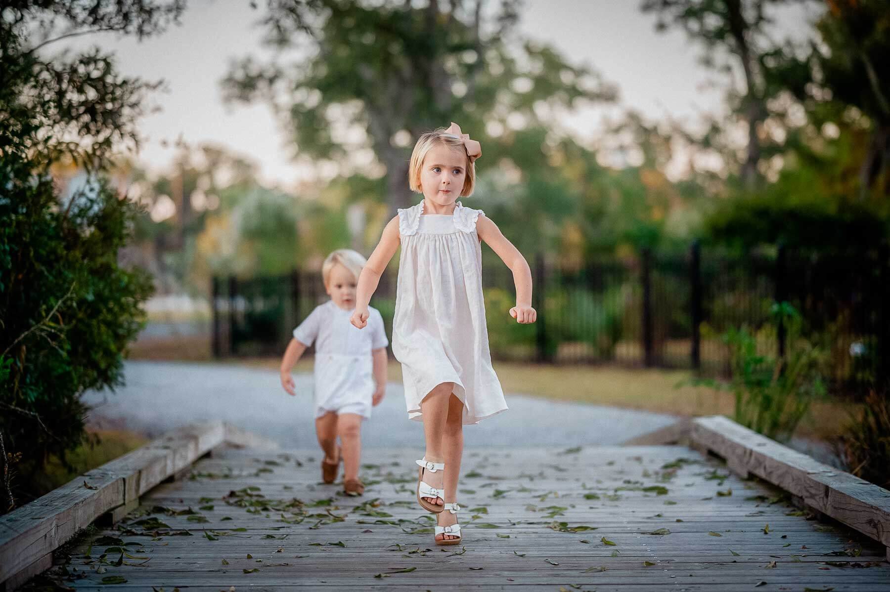girl-skipping-on-path-little-boy-behind.jpg
