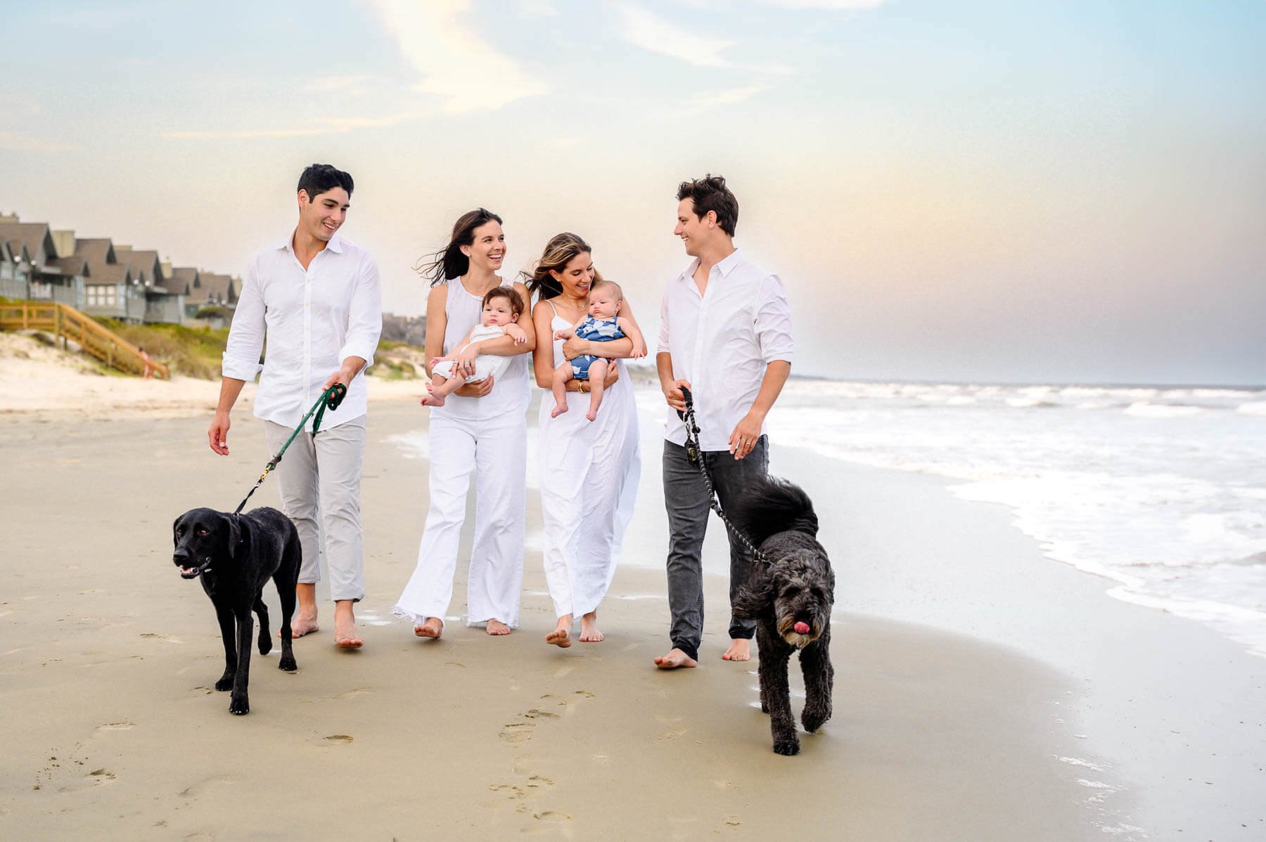 two-couples-with-babies-walking-on-beach-dogs.jpg
