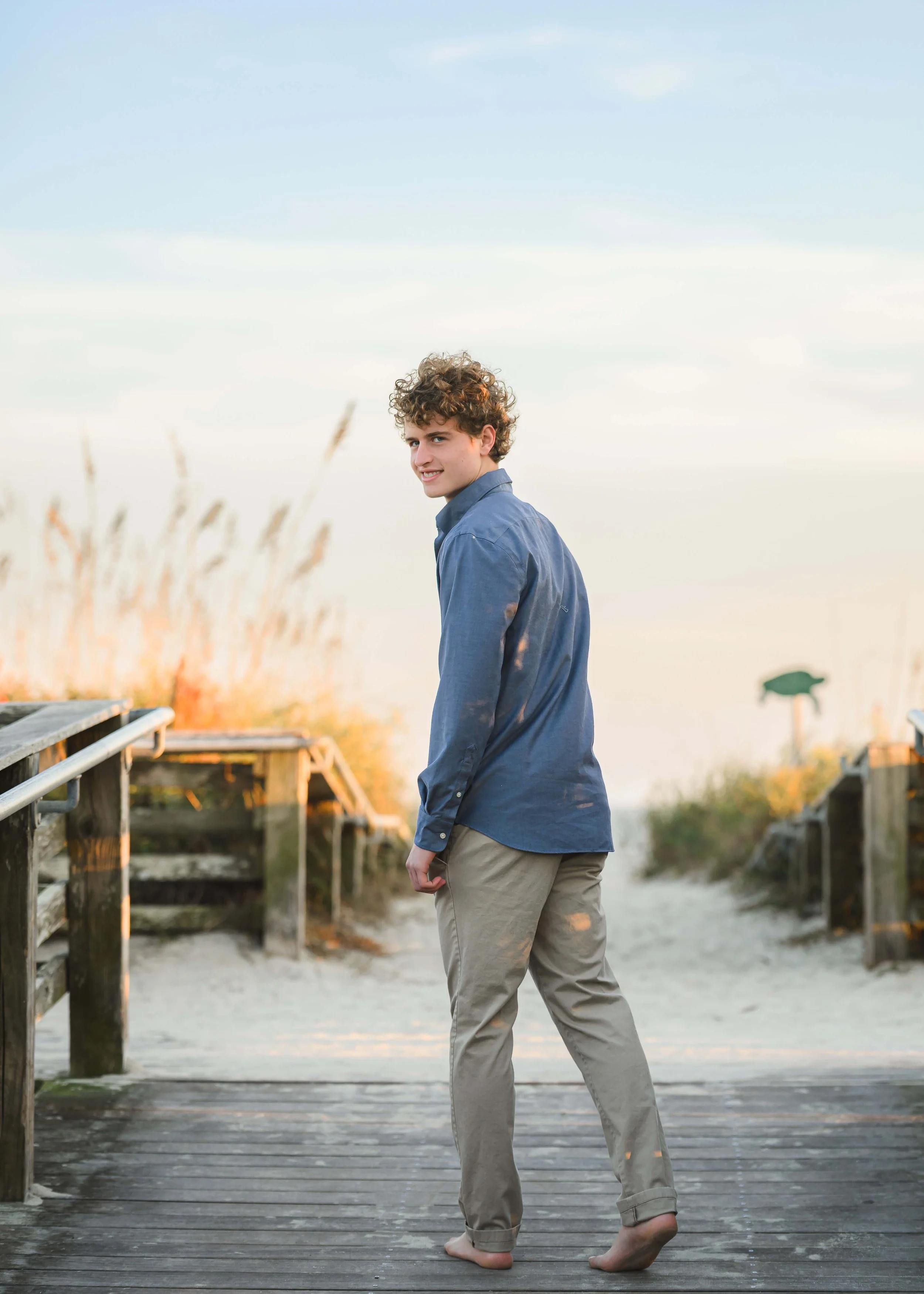 senior-portraits-boy-looking-back-beach-isle-of-palms.jpg