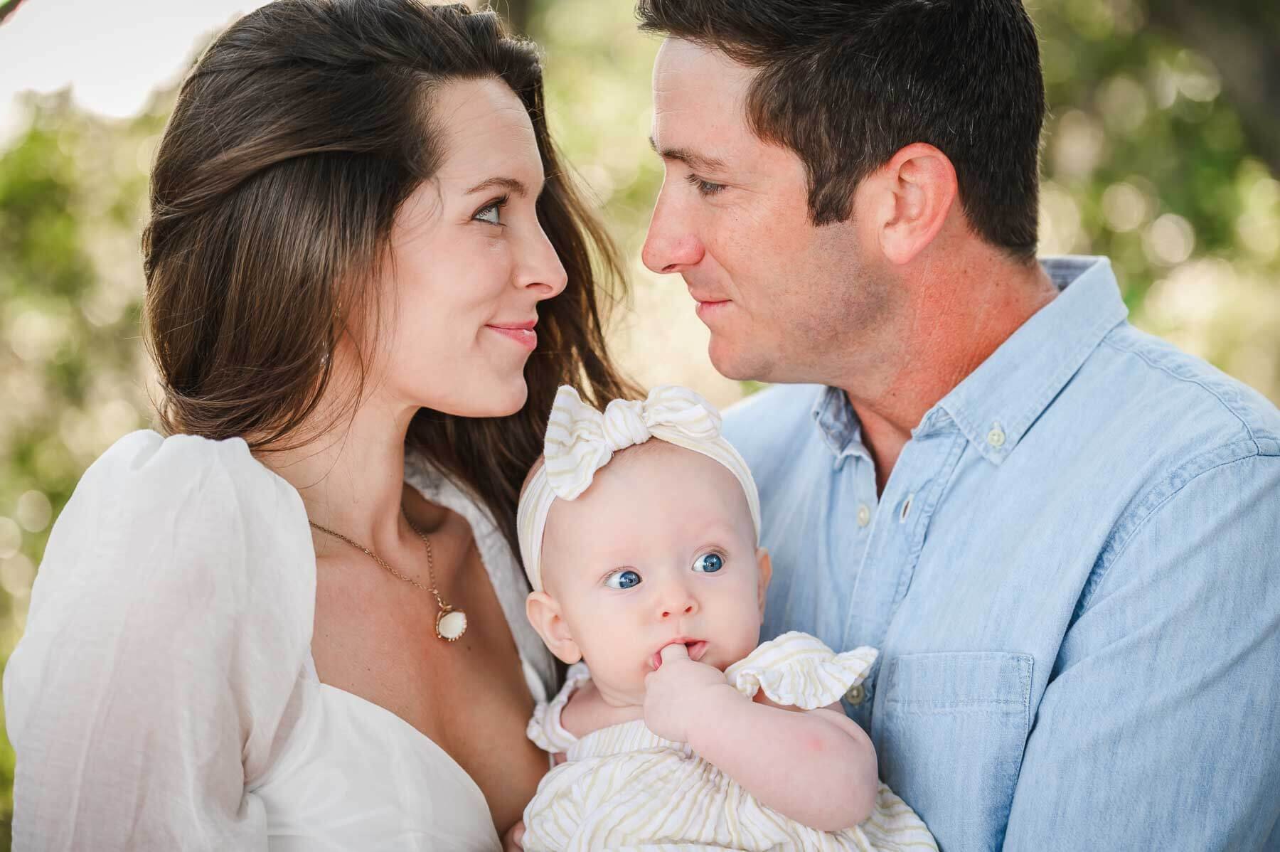 family-of-three-with-baby-embracing.jpg