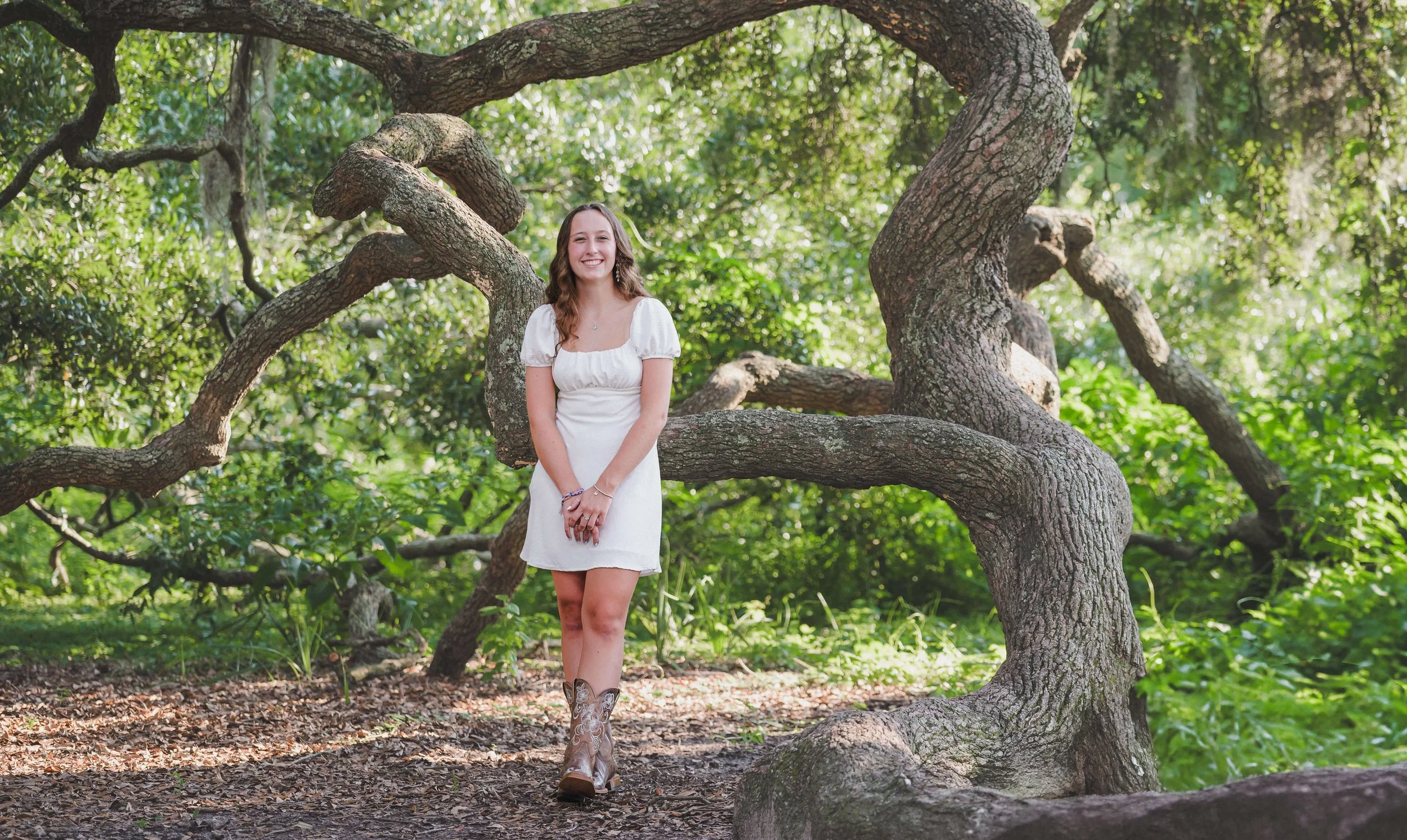 Charleston senior portrait under large live oak at Hampton Park