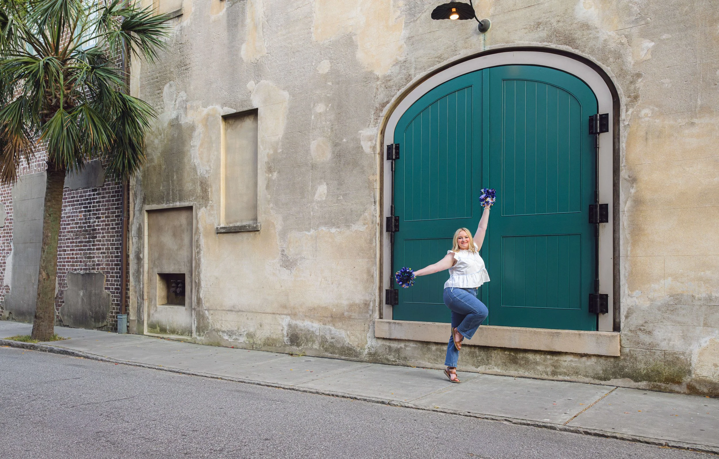 downtown-charleston-senior-portraits-dock-st.-theater-girl-pom-poms.jpg