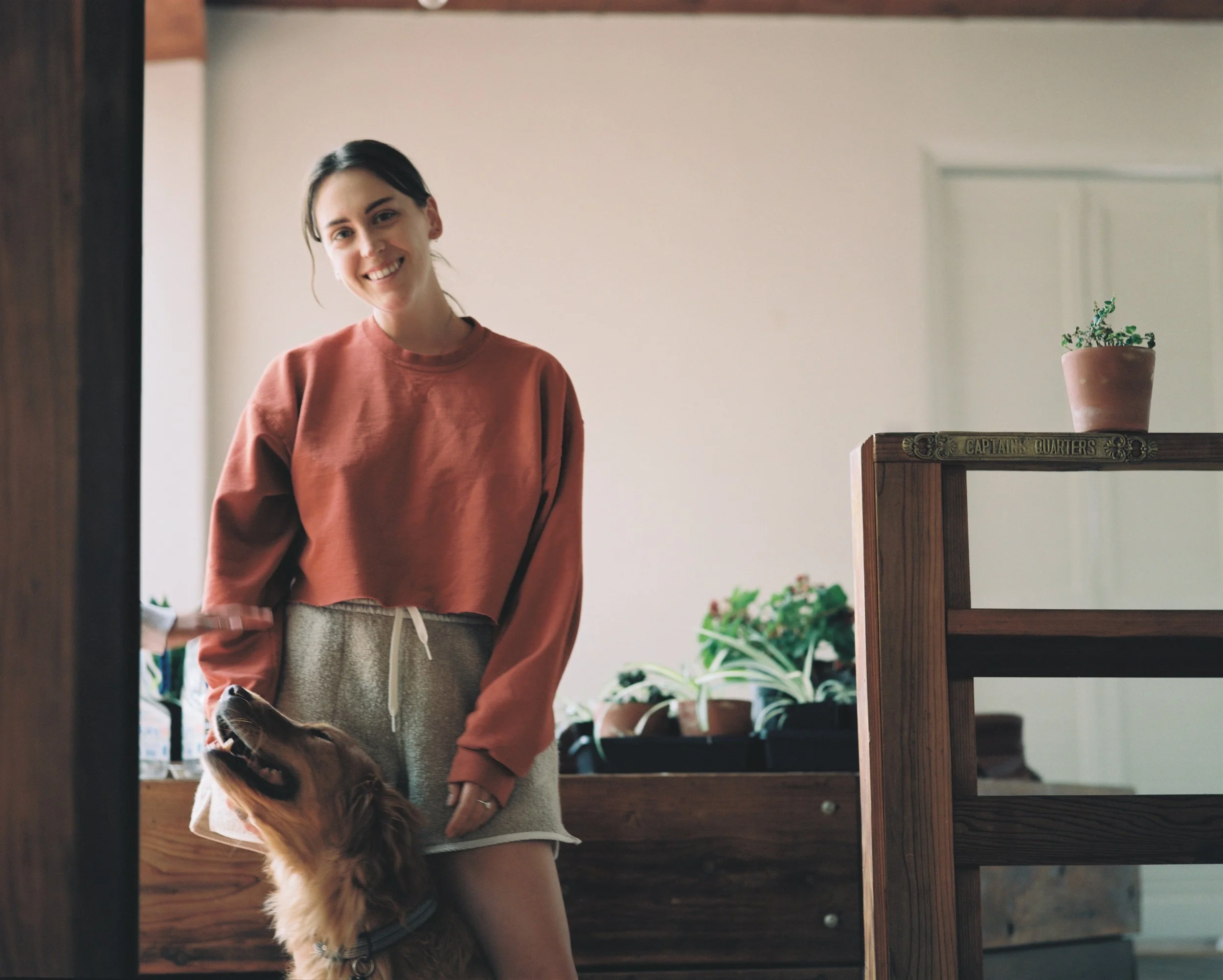Holistic Yoga Instructor with Golden Retriever