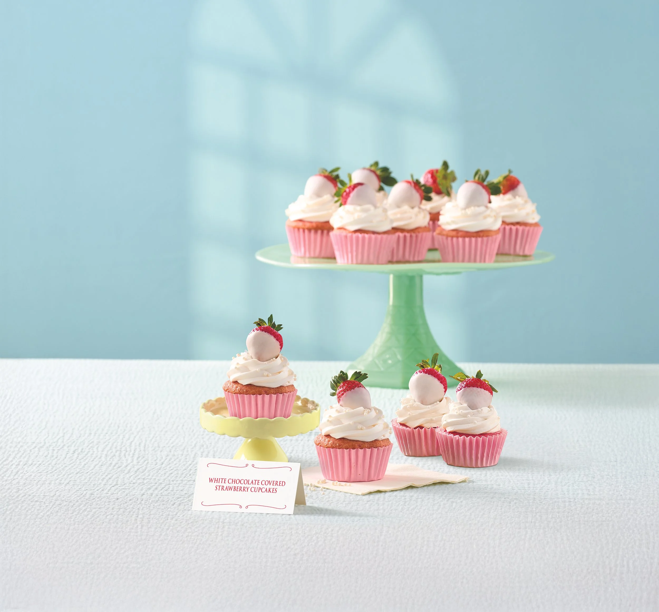 CUB26_Magazine_Spring_2026_SpringBrunch_WhiteChocolateCoveredStrawberryCupcakes_3_4_angle_Styled_0272 2.jpg