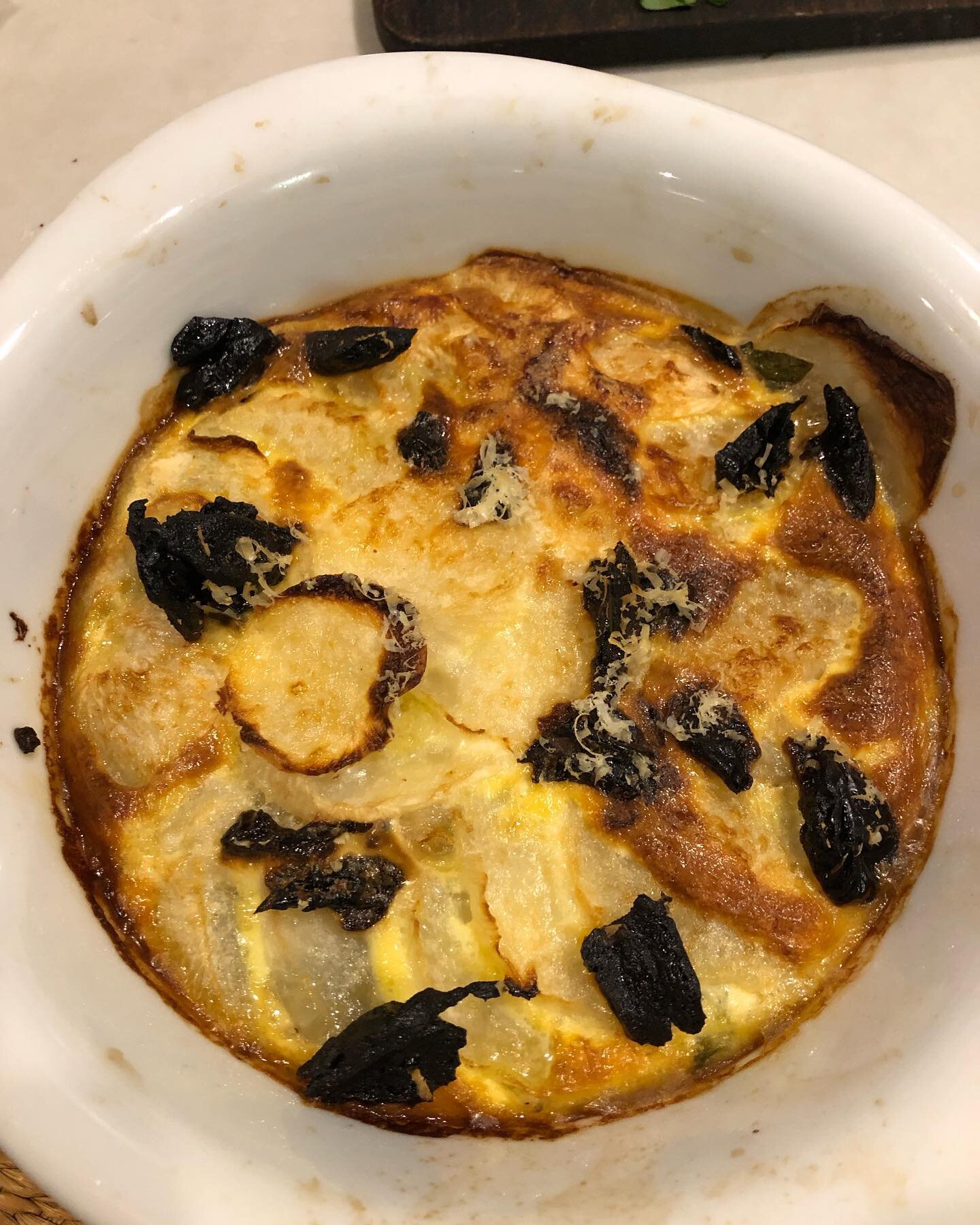 What&rsquo;s Rita cooking? Turnip gratin, adapted slightly from a @pmouchel recipe. Sliced blanched turnips on top of shallot and - ideally, silverbeet leaves, but I used the outer leaves of a cos lettuce. Milk, cream, an egg, seasonings - and althou