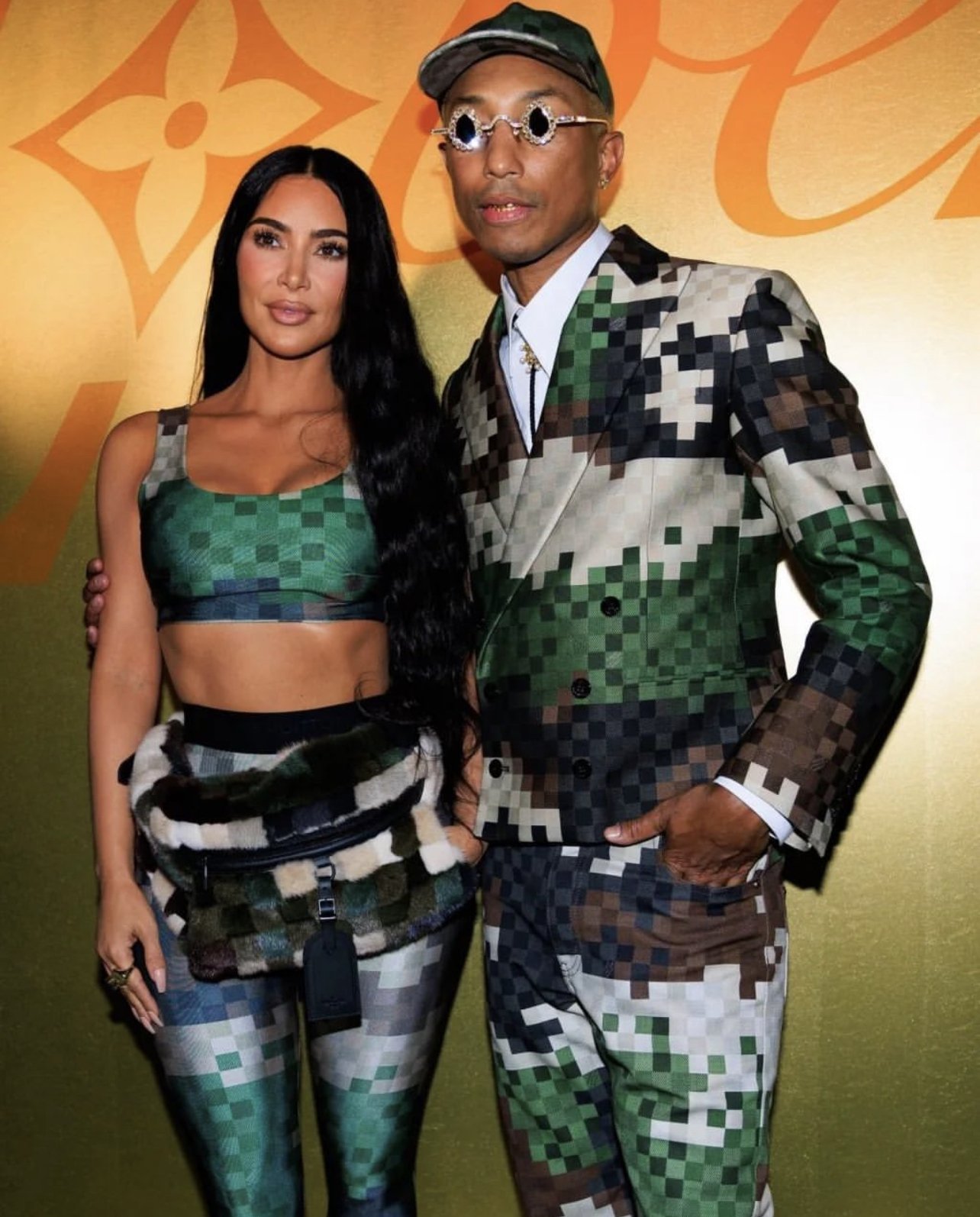Kelly Rowland Suits Up for Pharrell's Louis Vuitton Debut Show – Footwear  News