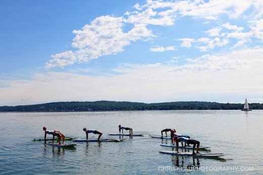 Paddle Into Fitness ran a successful training on beautiful Lake Michigan with Yen Yoga & Fitness in Traverse City. Here they are having fun doing reverse table top. Thanks again for having us!