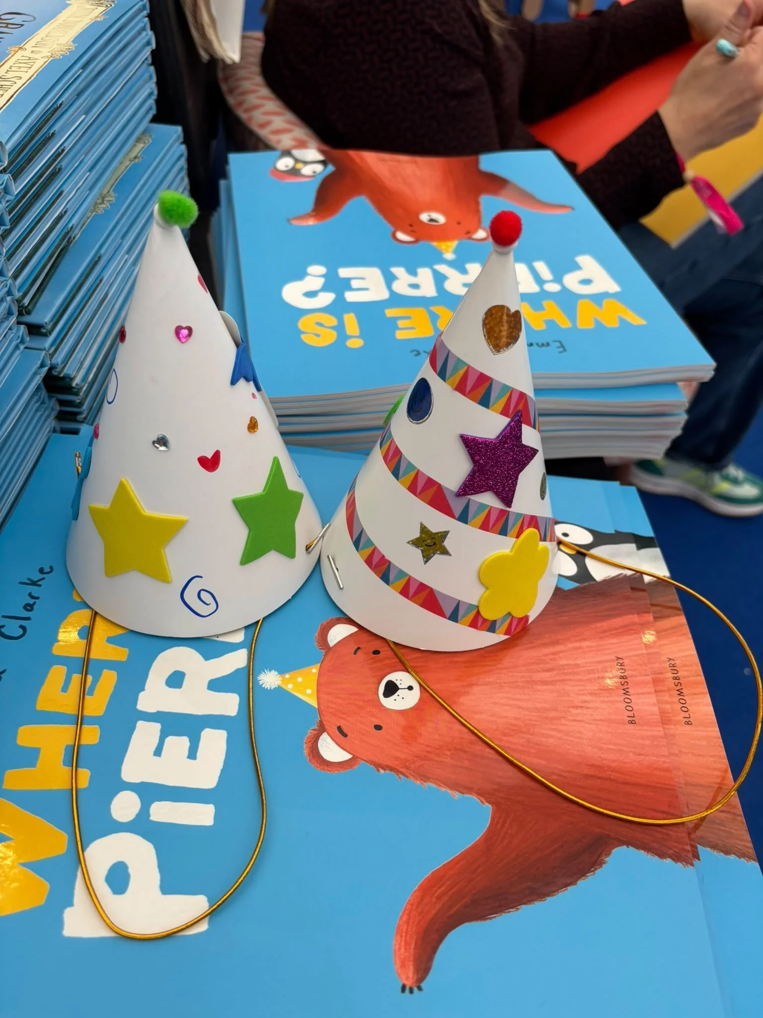 Decorated party hats at an author and illustrator event. 