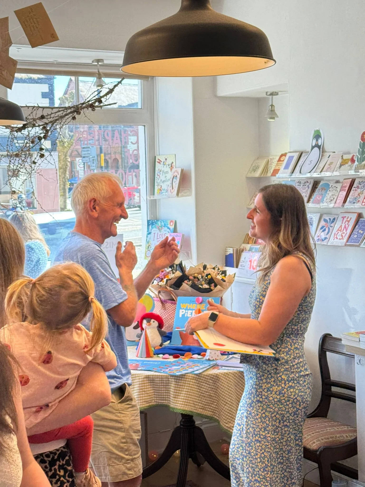 Children's Author and Illustrator Emma Clarke signing books.