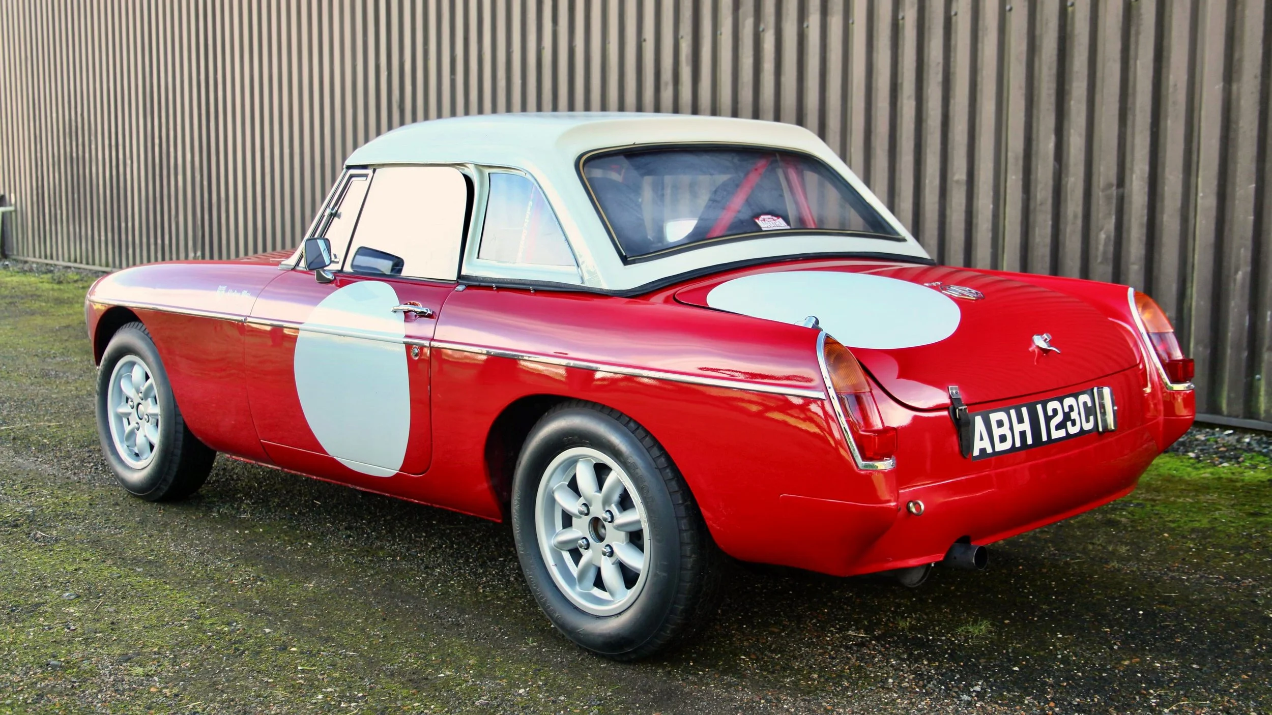 1965 MGB Roadster ex-Sir Stirling Moss Rear Three Quarters.jpg