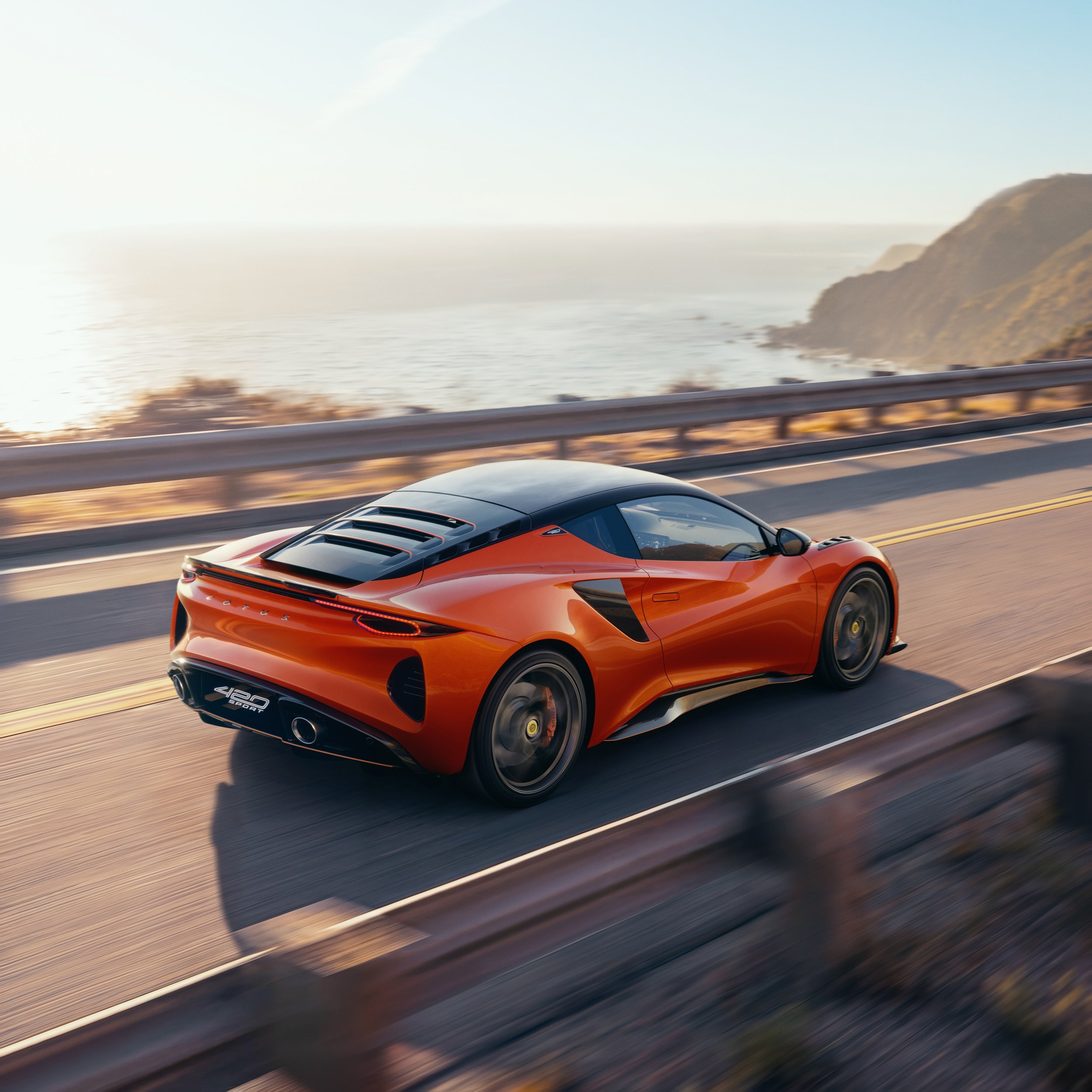 Lotus_Emira_420_Sport_Rear_Driving.jpg