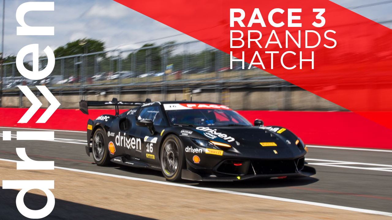 Race car driving on a race track with branding for race 3 at Brands Hatch, featuring a black race car numbered 16 with sponsor logos.