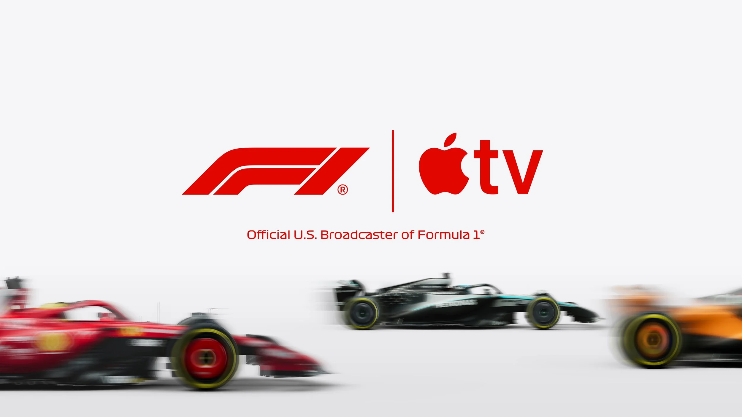 Formula 1 cars racing with the logos of Formula 1 and Apple TV, indicating official broadcast partnership.