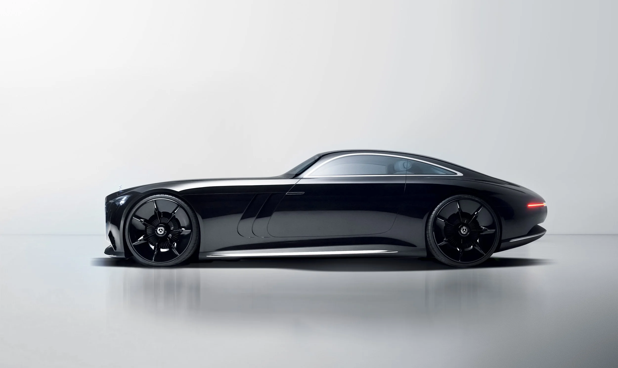 A sleek, black luxury sports car with a modern, aerodynamic design, low profile, and large black rims, set against a minimalistic light gray background.