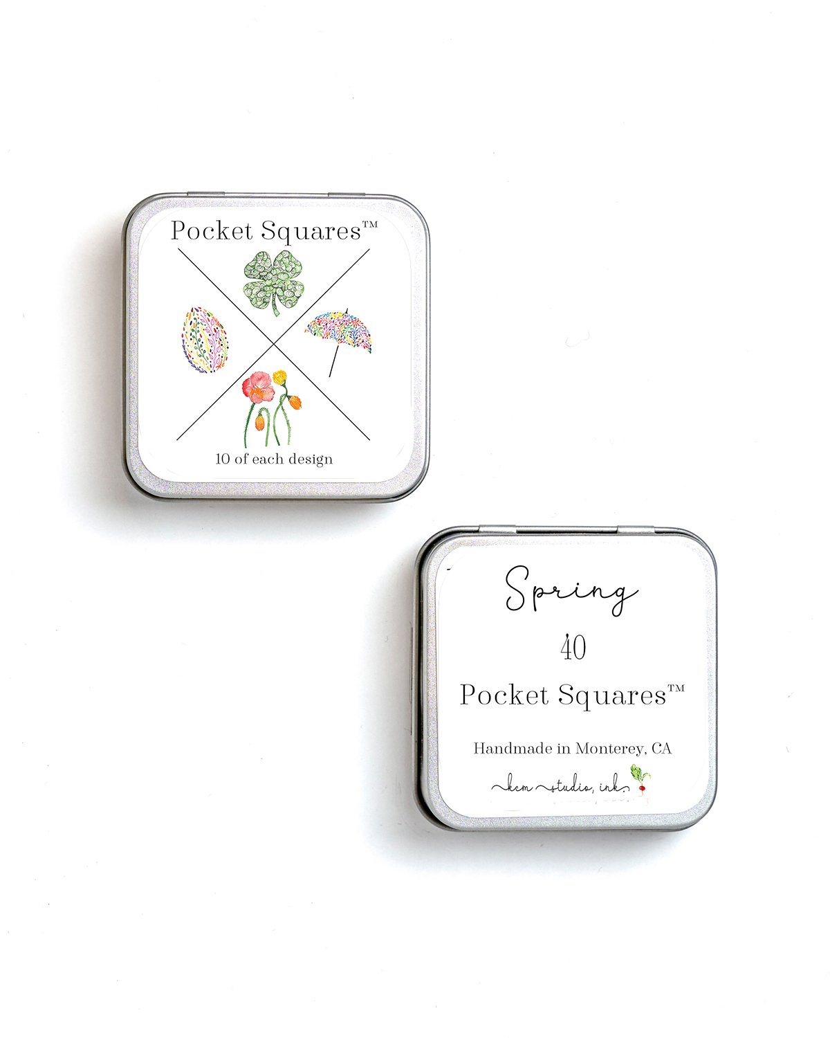 Two decorative tins of Pocket Squares with colorful, floral and abstract designs. The larger tin features a four-leaf clover, floral, and umbrella illustrations, labeled 'Pocket Squares™' with '10 of each design.' The smaller tin, labeled 'Spring 40,