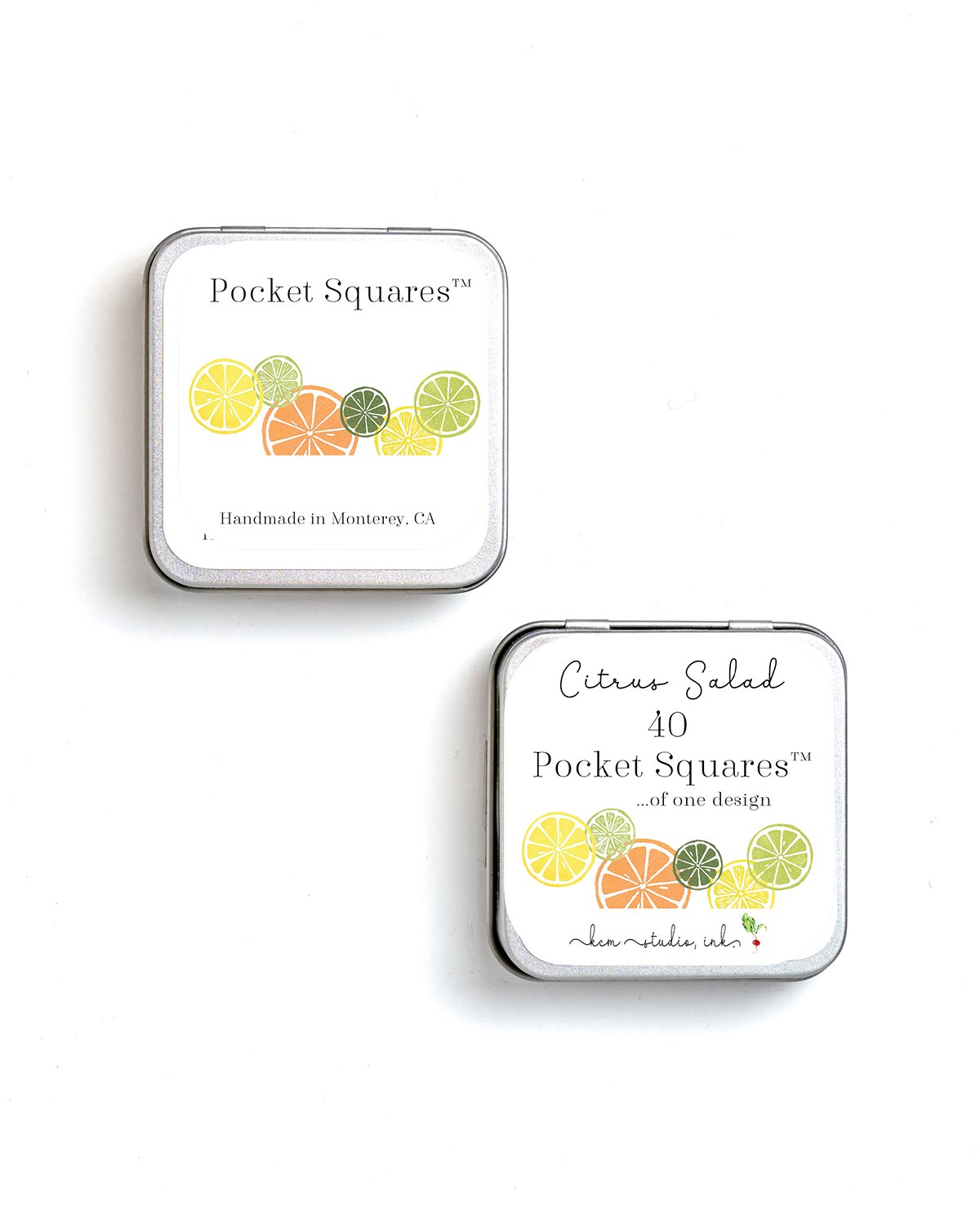 Two small metal tins of Pocket Squares with citrus-themed labels, featuring illustrations of lemon, lime, orange, and other citrus slices, placed on a white background.