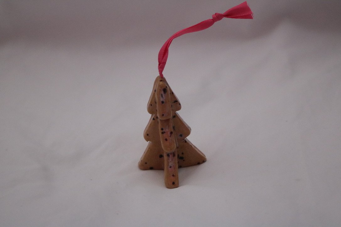 Pink 3d geometric Christmas tree with pink ribbon