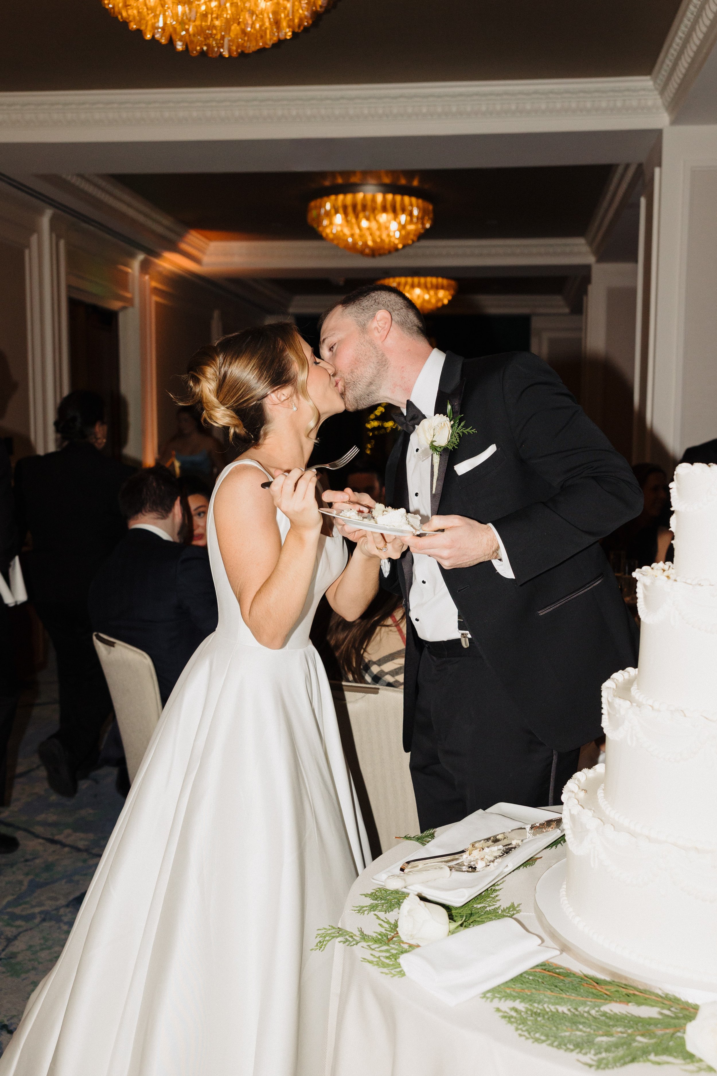 Bride and groom kiss at their wedding reception at The Newbury Boston