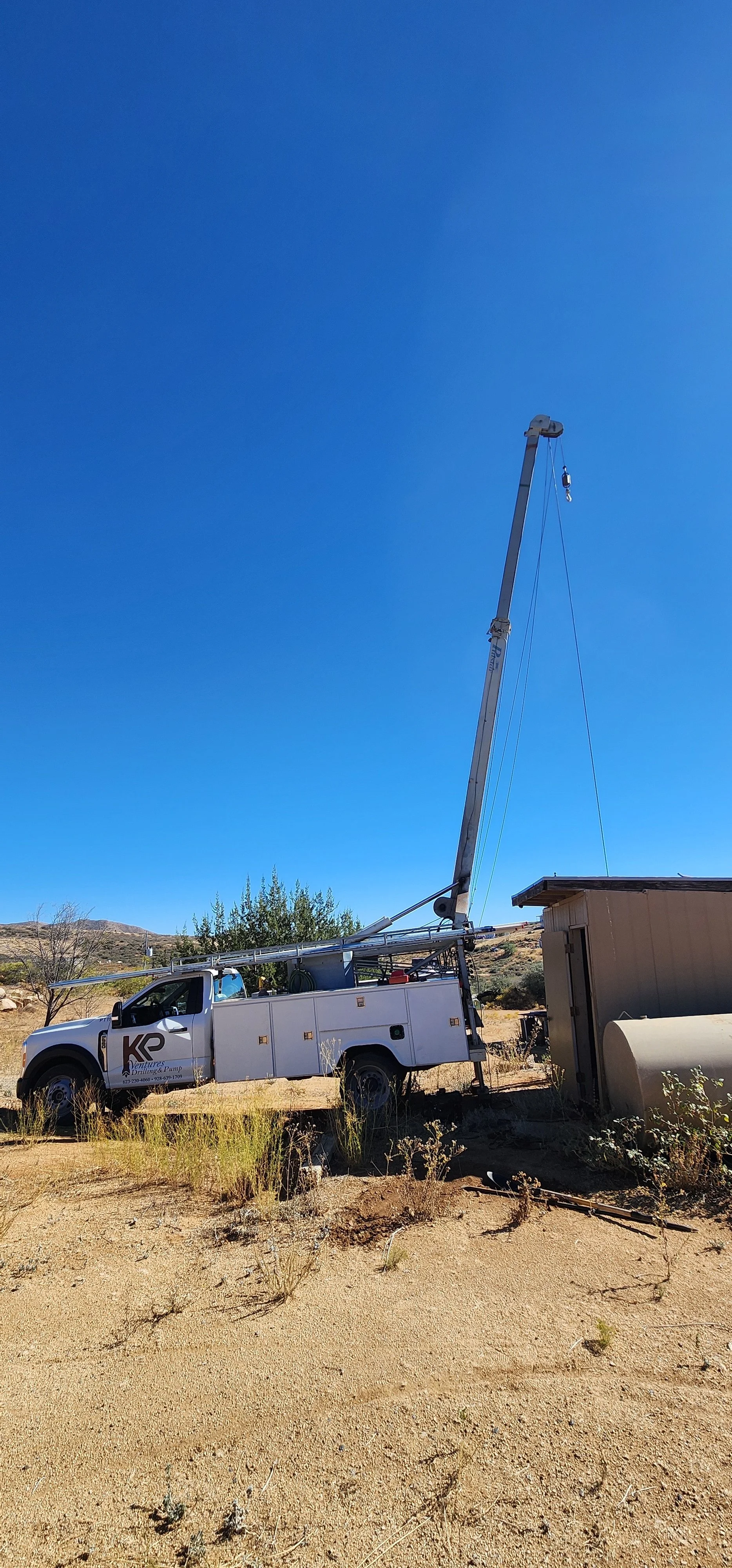 Residential water well pump service rig equipped for pump installation, repair, replacement, and maintenance of private water well systems.