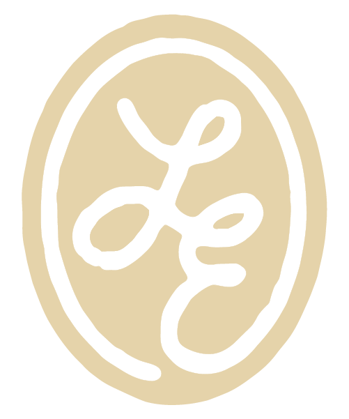 A beige oval with black abstract line art inside.
