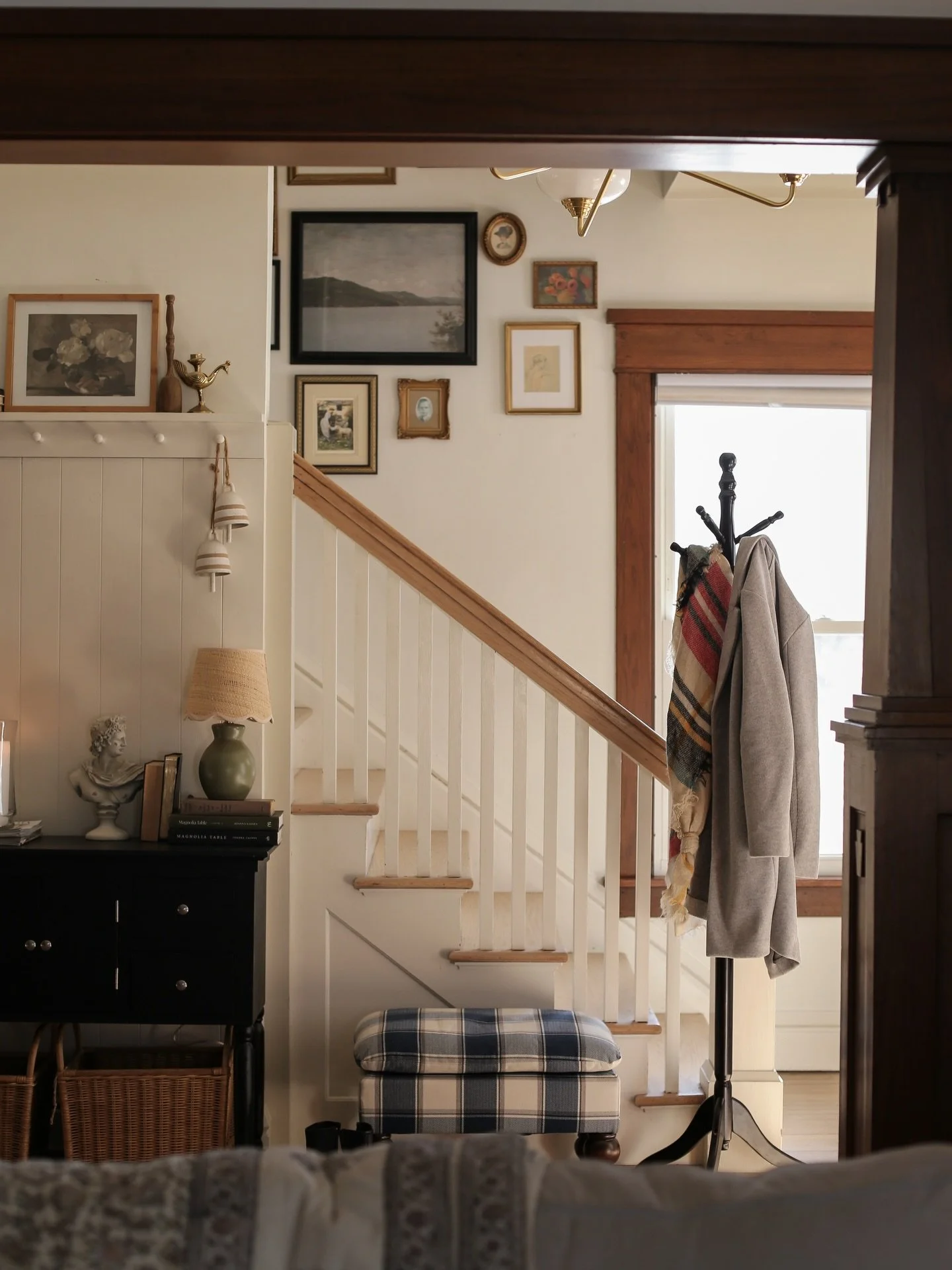 This entryway was the moment that sold me on this house when we first walked through the door eight years ago.

And yet&hellip; I was so overwhelmed by all the original wood trim that I almost painted over it. 🙃 Can you believe that?

But over time,
