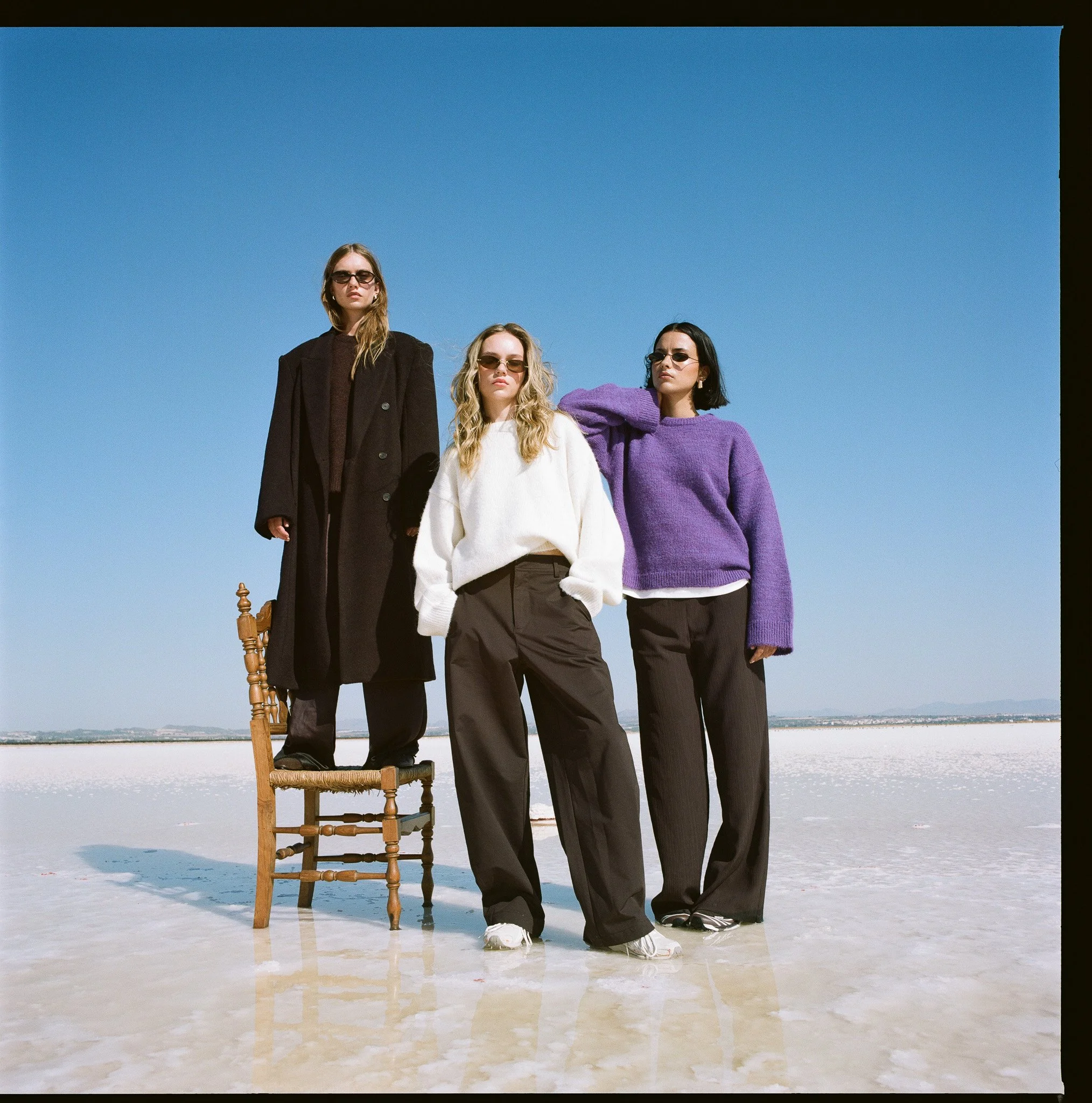 Inspired by vintage Helmut Newton vogue editorial photographs for vogue, NYC fashion photographer & director duo Indie Studios production team creates a timeless luxury fashion photo & video campaign for knitwear brand in Spanish desert