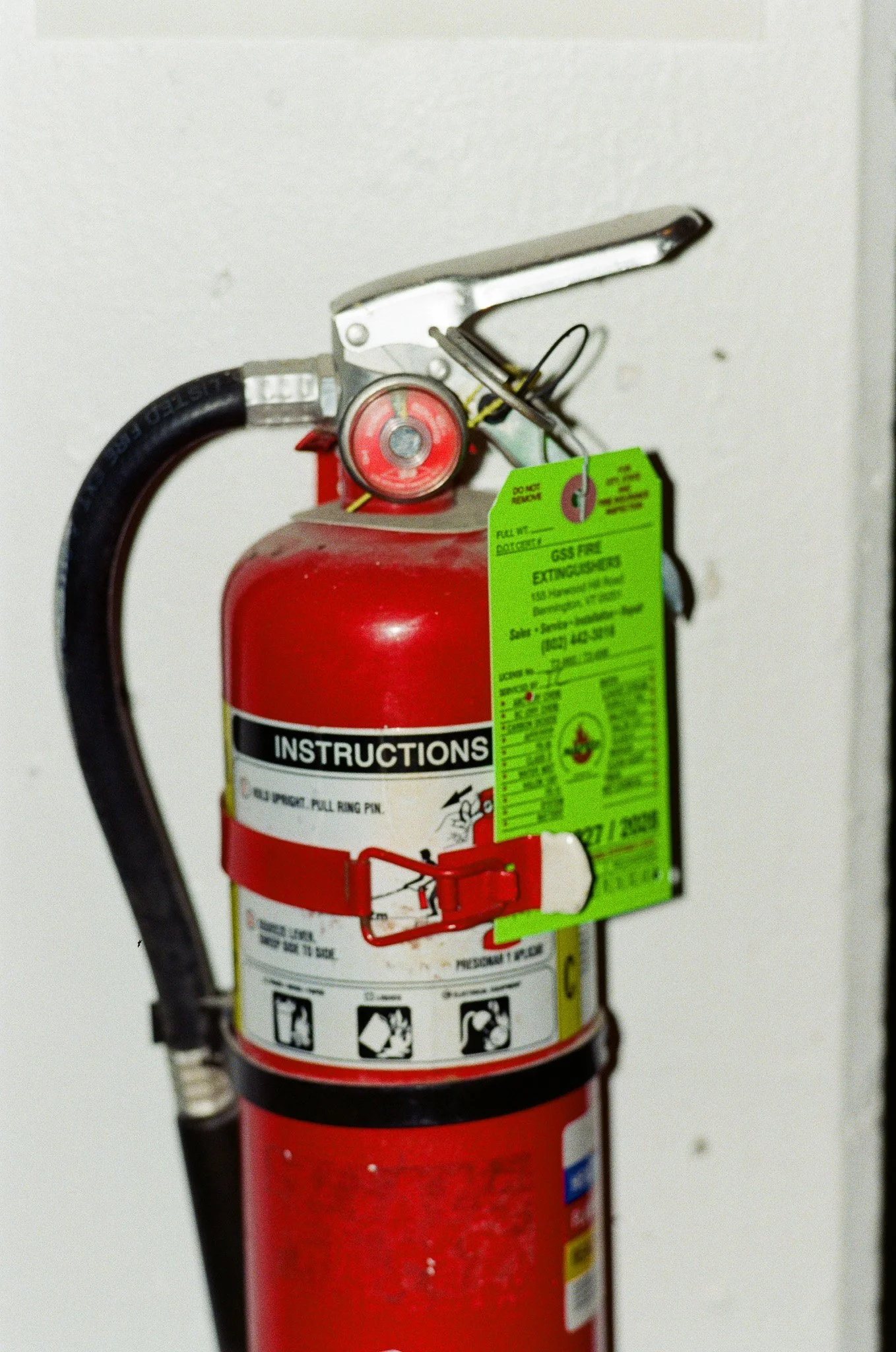 Still-life film photo of Red fire extinguisher taken with Juergen Teller camera by Sam Bates of New York City based Indie Studios to collage in fashion advertising campaign.