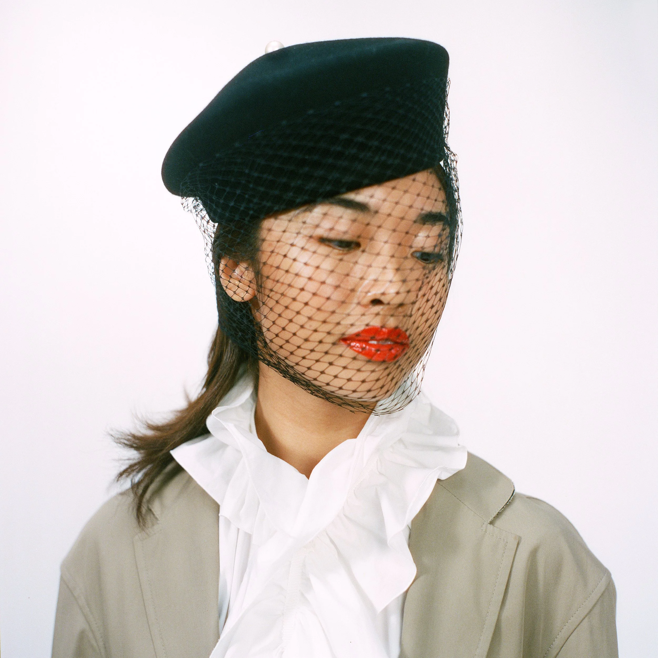 Ballet dancer Kayla Mak wearing a vail and red lipstick in a Dior look photographed in studio by fashion photographer indie studios is one of the best fashion photographers in new york city.