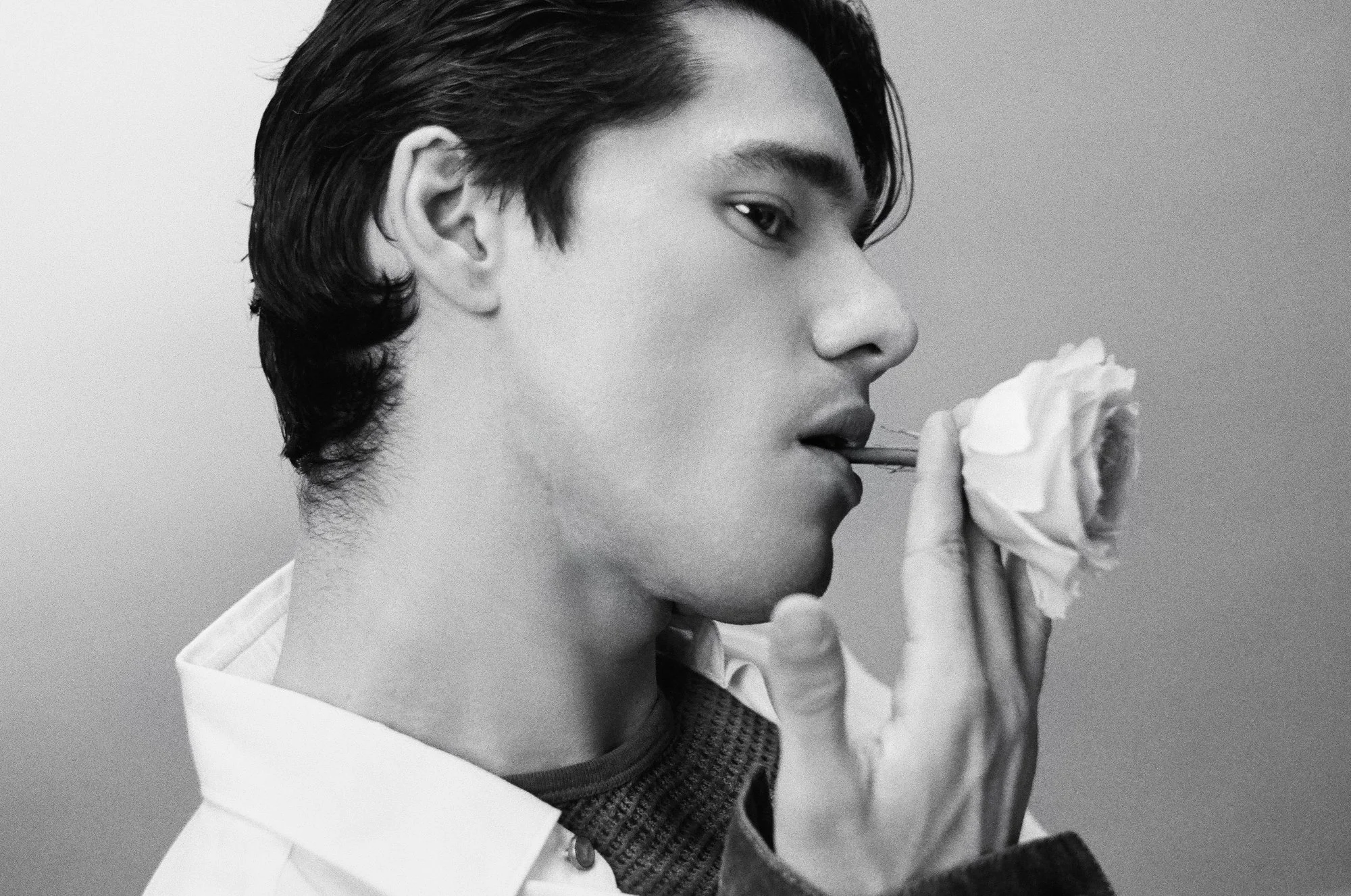 Artistic Mens fashion editorial on film for glass magazine by New York photographer and director duo Indie Studios features model Jovani Furlan in luxury designer brands Prada, Louis Vuitton, Hermes & Christian Dior on painted backdrop
