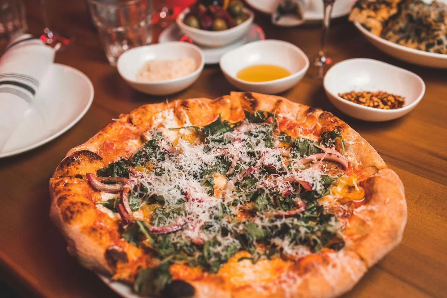 The table is set and the pizza is sliced - all you need now is a reservation! Head to the link in our bio to reserve your seat 🍕🍷