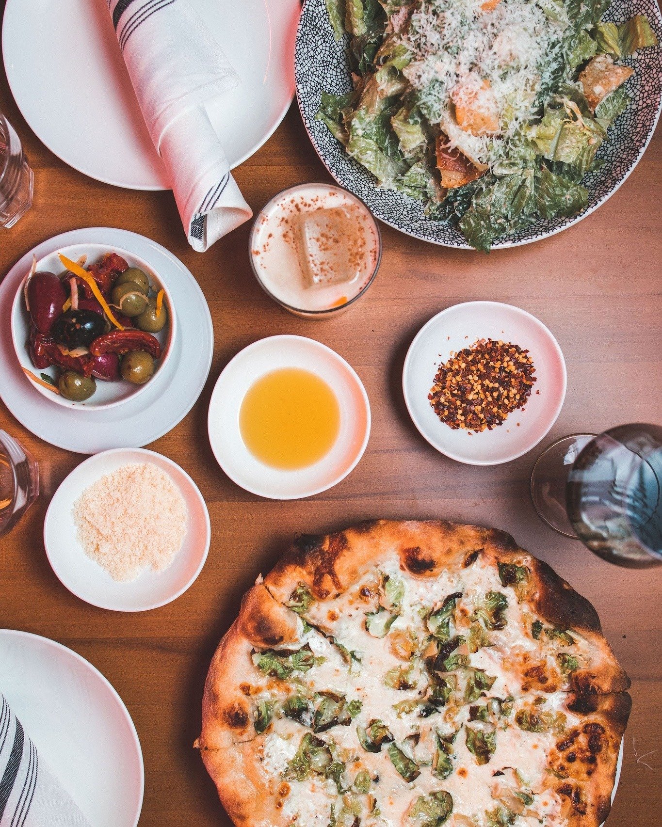 A table full of flavor at Torrey Park. 🍕🥗

Wood-fired pizza, fresh salads, and all the little extras that make dinner feel like an experience. Gather around and dig in. ✨