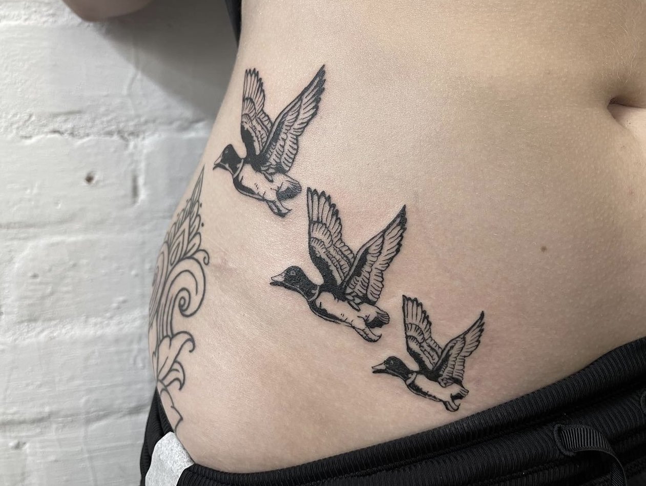 Flying duck tattoo