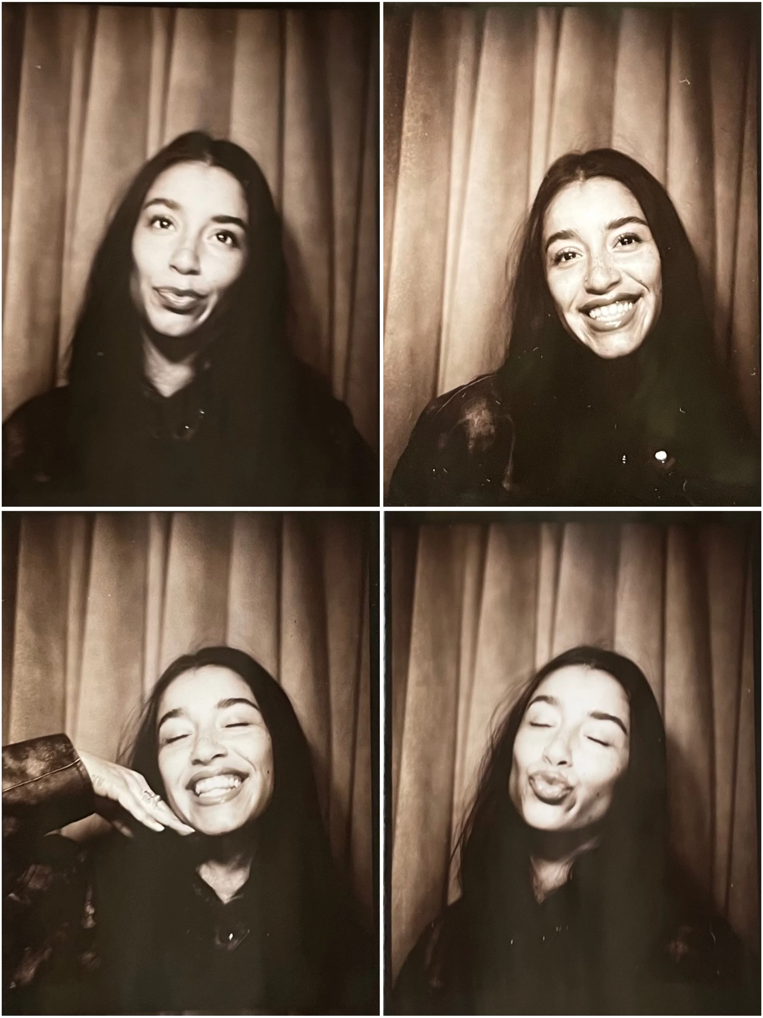 Grid of four black-and-white photo booth images of a woman with long dark hair in front of a curtain background, making silly and expressive faces.