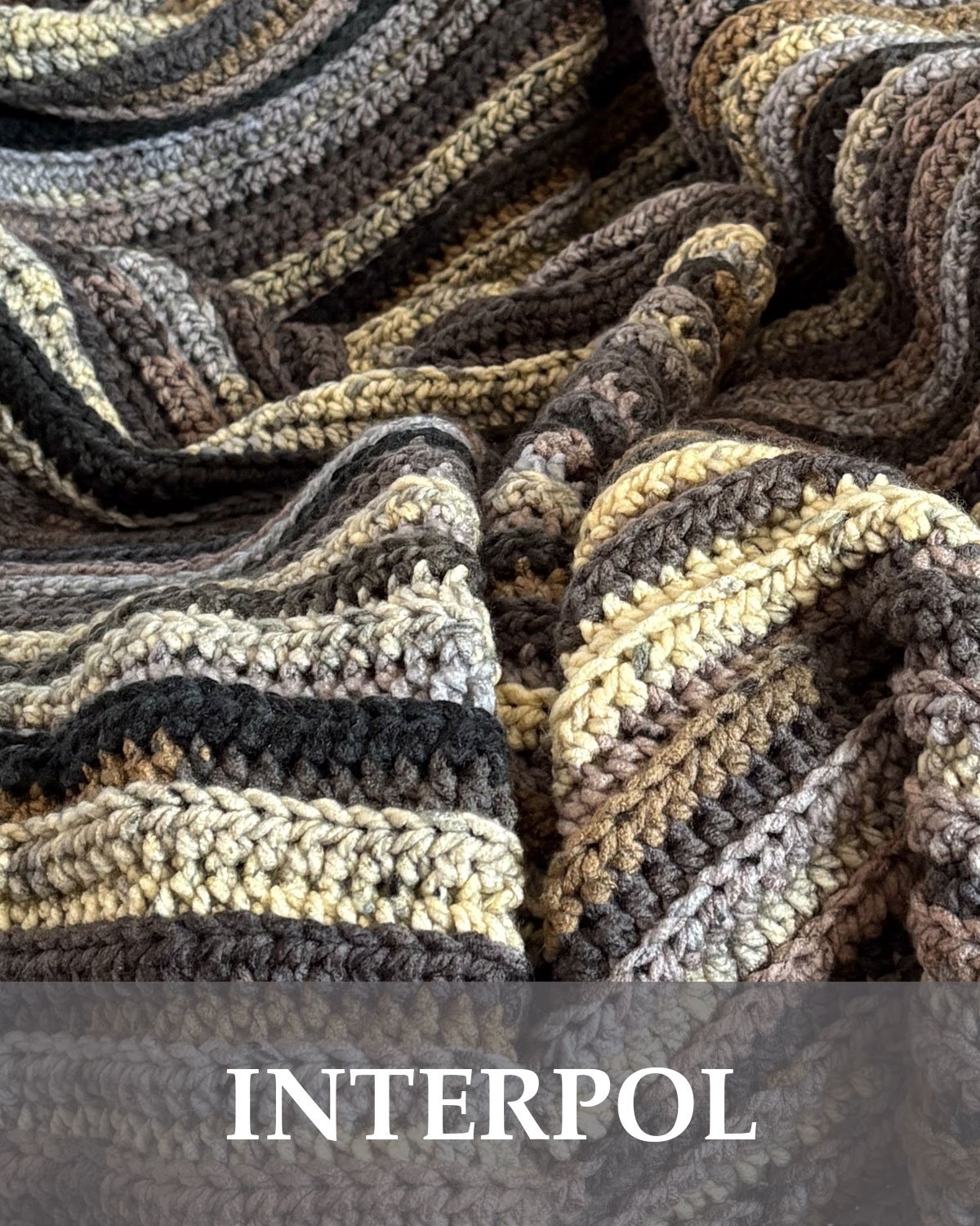 Handmade Interpol crochet throw blanket in cream, grey, brown and purple