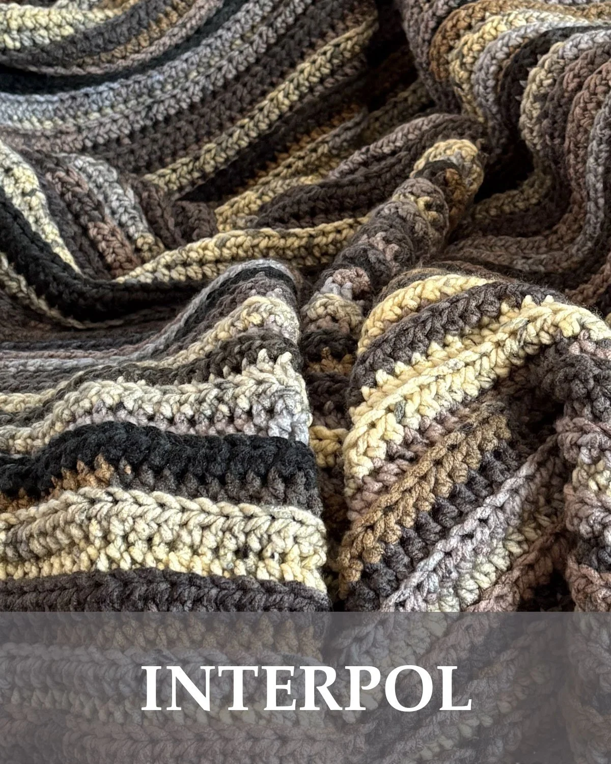 Handmade crochet throw blanket featuring a cream, grey, brown, and purple striped design. Each blanket is crocheted by hand and makes a cozy one of a kind addition to a bedroom, living room, or reading space. Approximately 50" x 60"