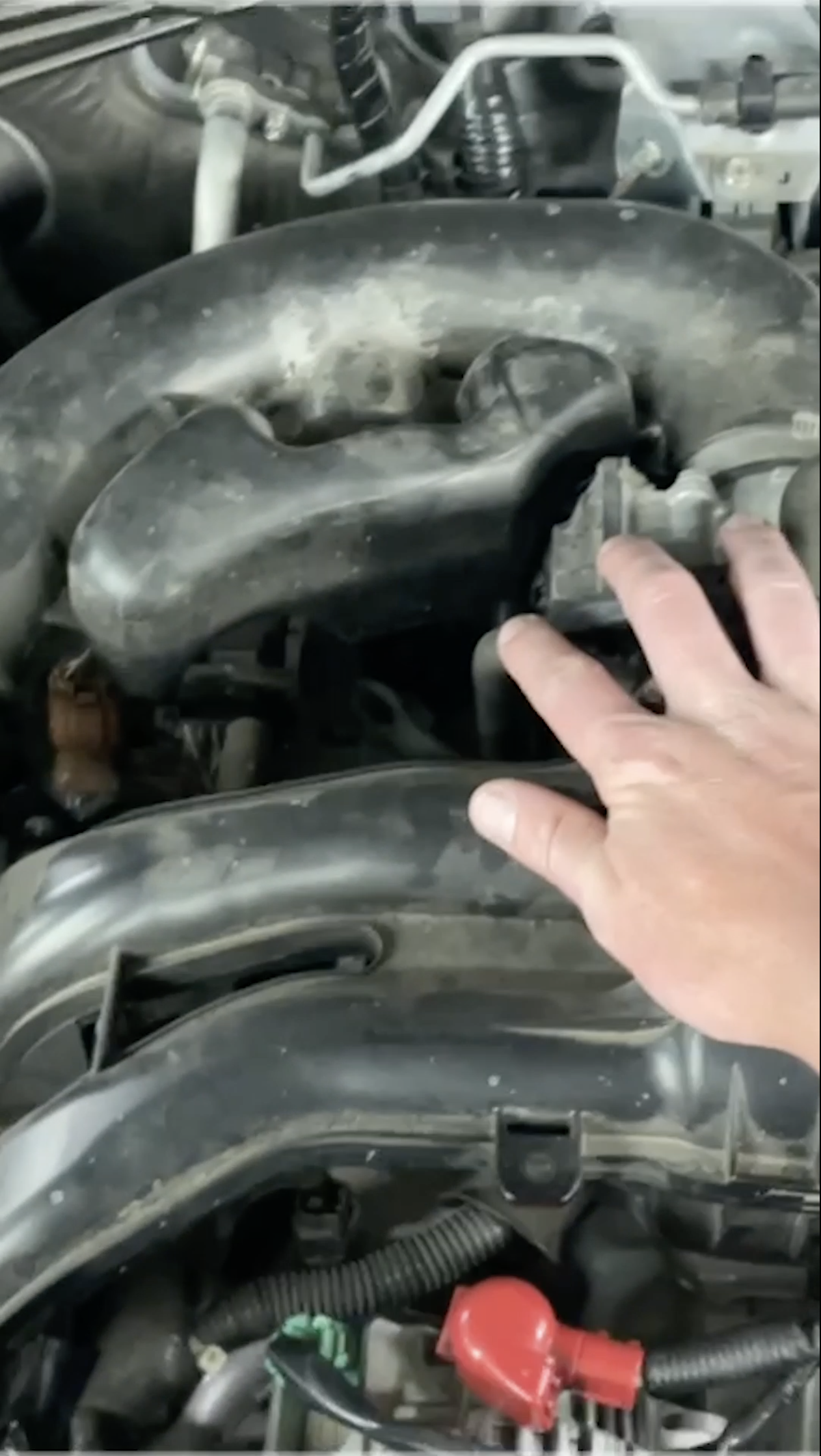 Shot 2- Auto Body - Hand moves away to check engine or paints left to right
